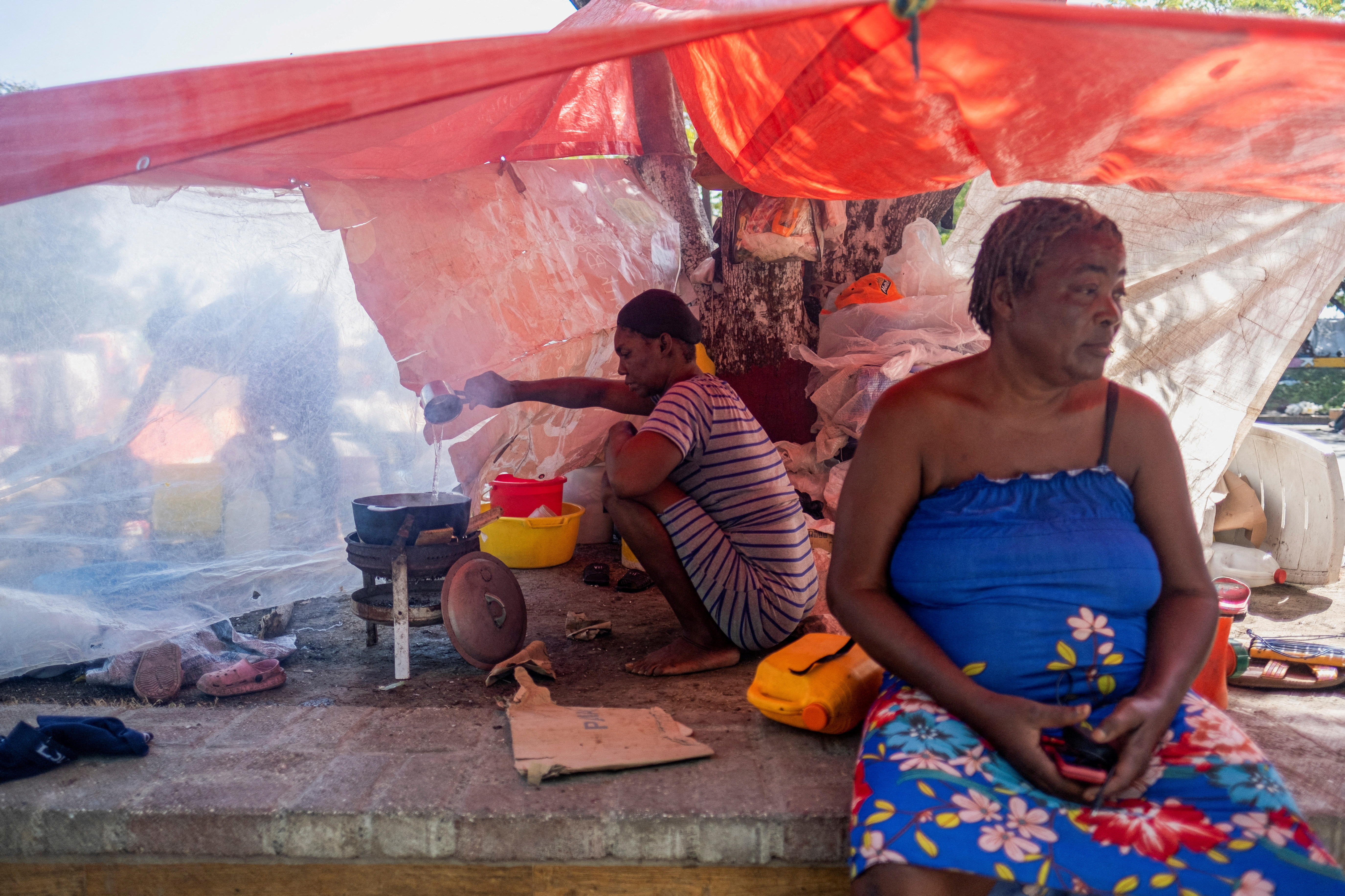 People displaced by gang war violence in Cite Soleil take refuge at the Hugo Chavez Square in Port-au-Prince.
