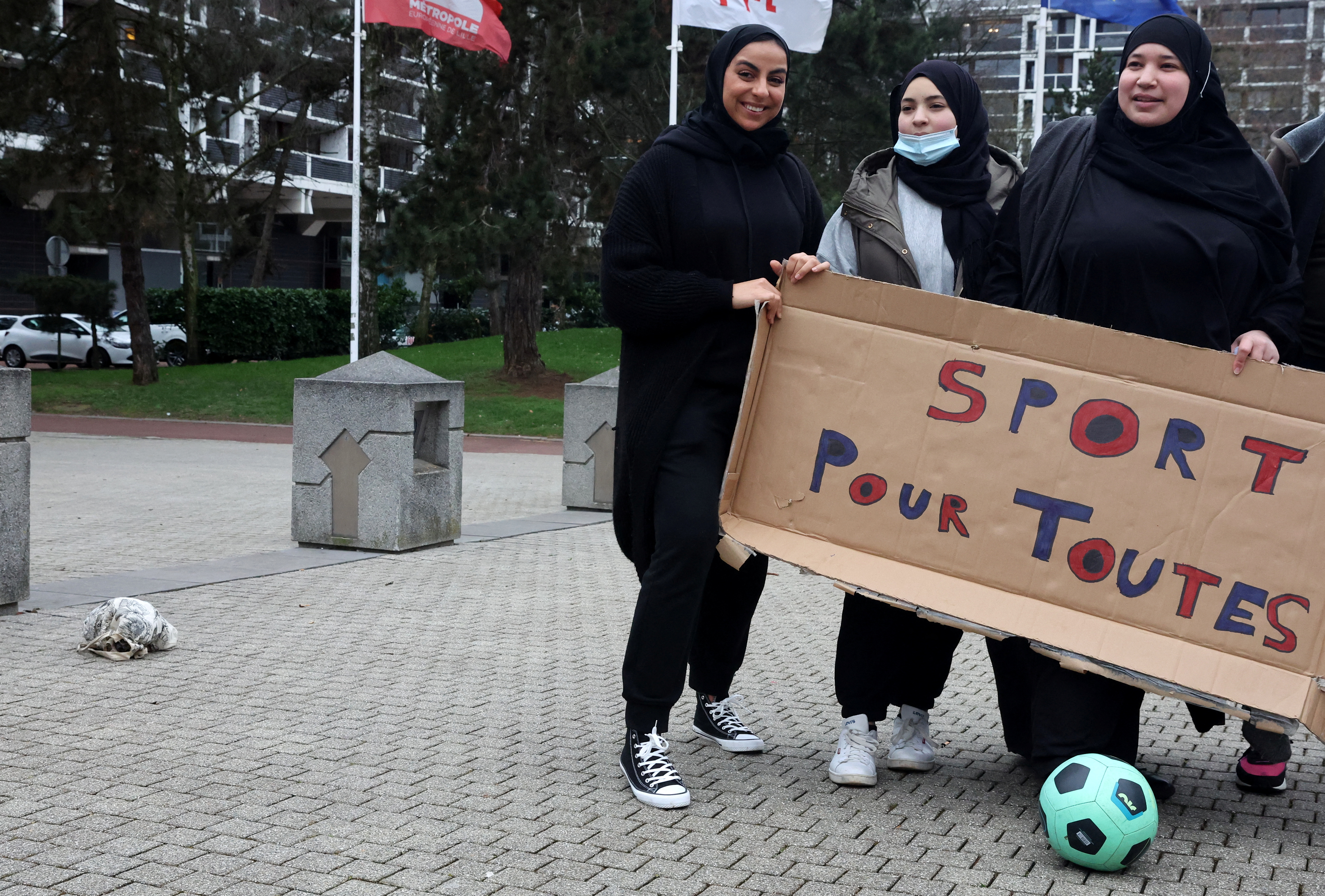 Supporters of Muslim women soccer players protest against French hijab ban in sports, in Lille