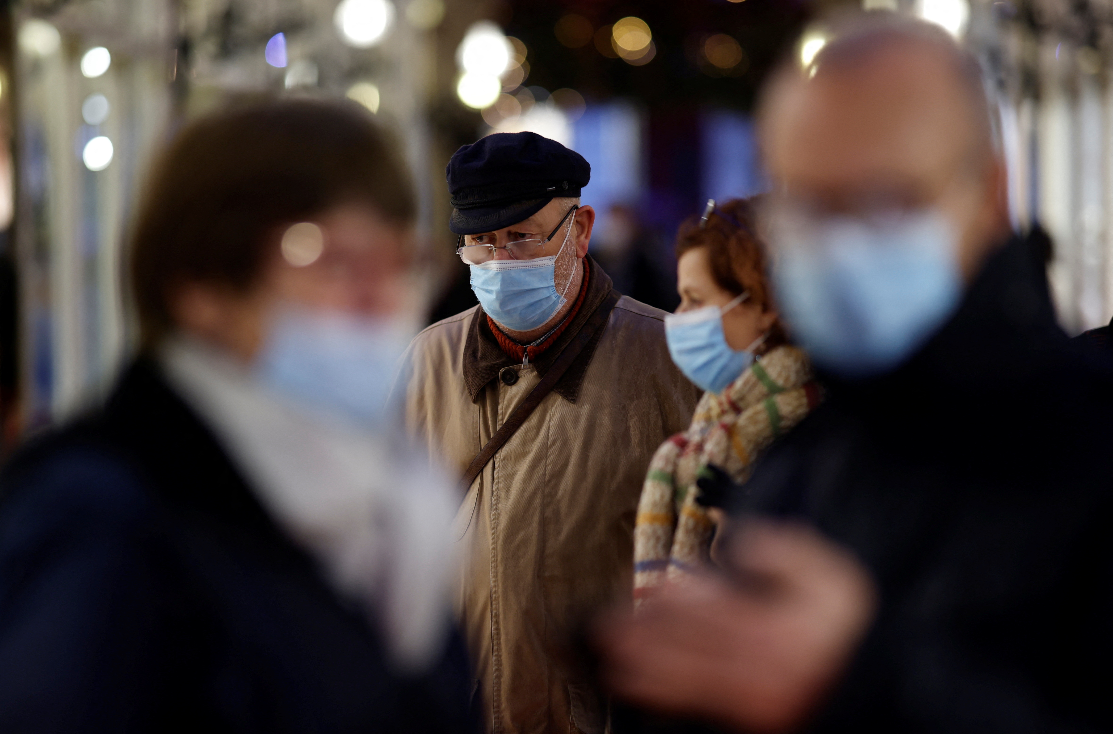 People wearing face masks walk in Nantes amid the coronavirus disease (COVID-19) outbreak in France, December 9, 2021. REUTERS/Stephane Mahe