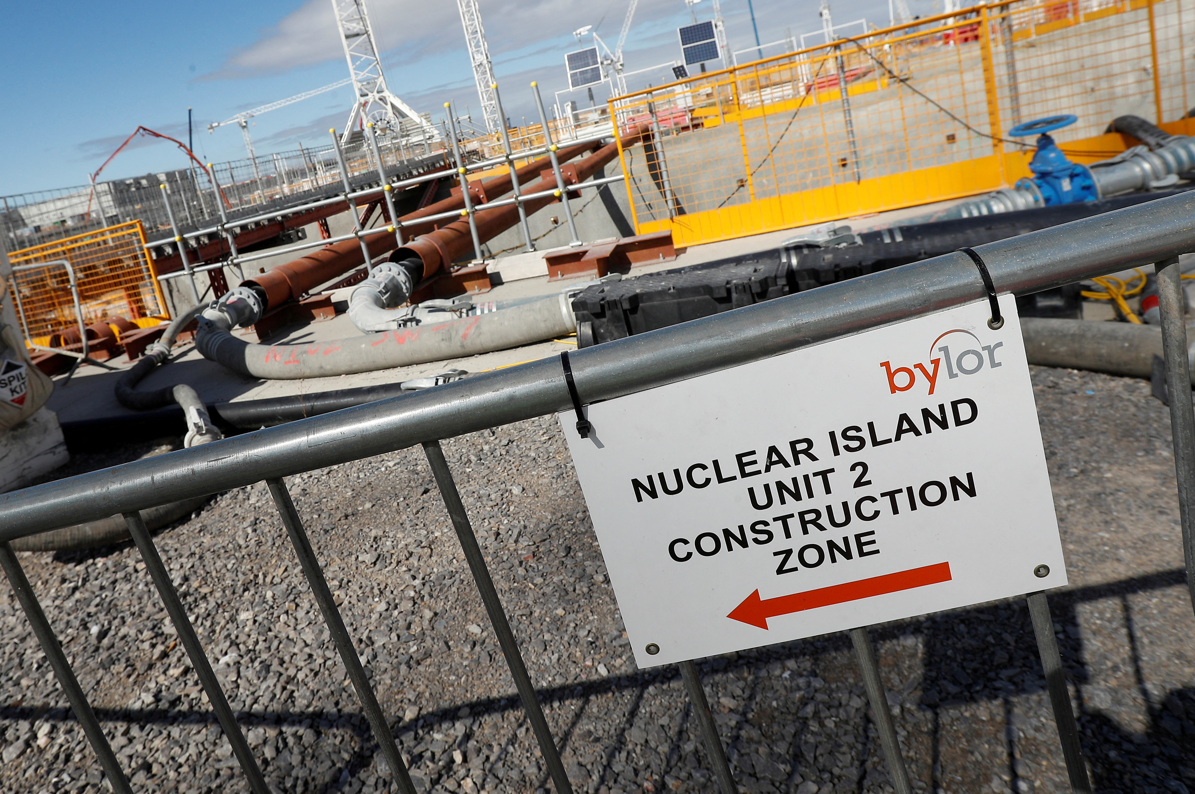 A sign that directs people to the nuclear reactor area under construction, is seen at Hinkley Point C nuclear power station site, near Bridgwater