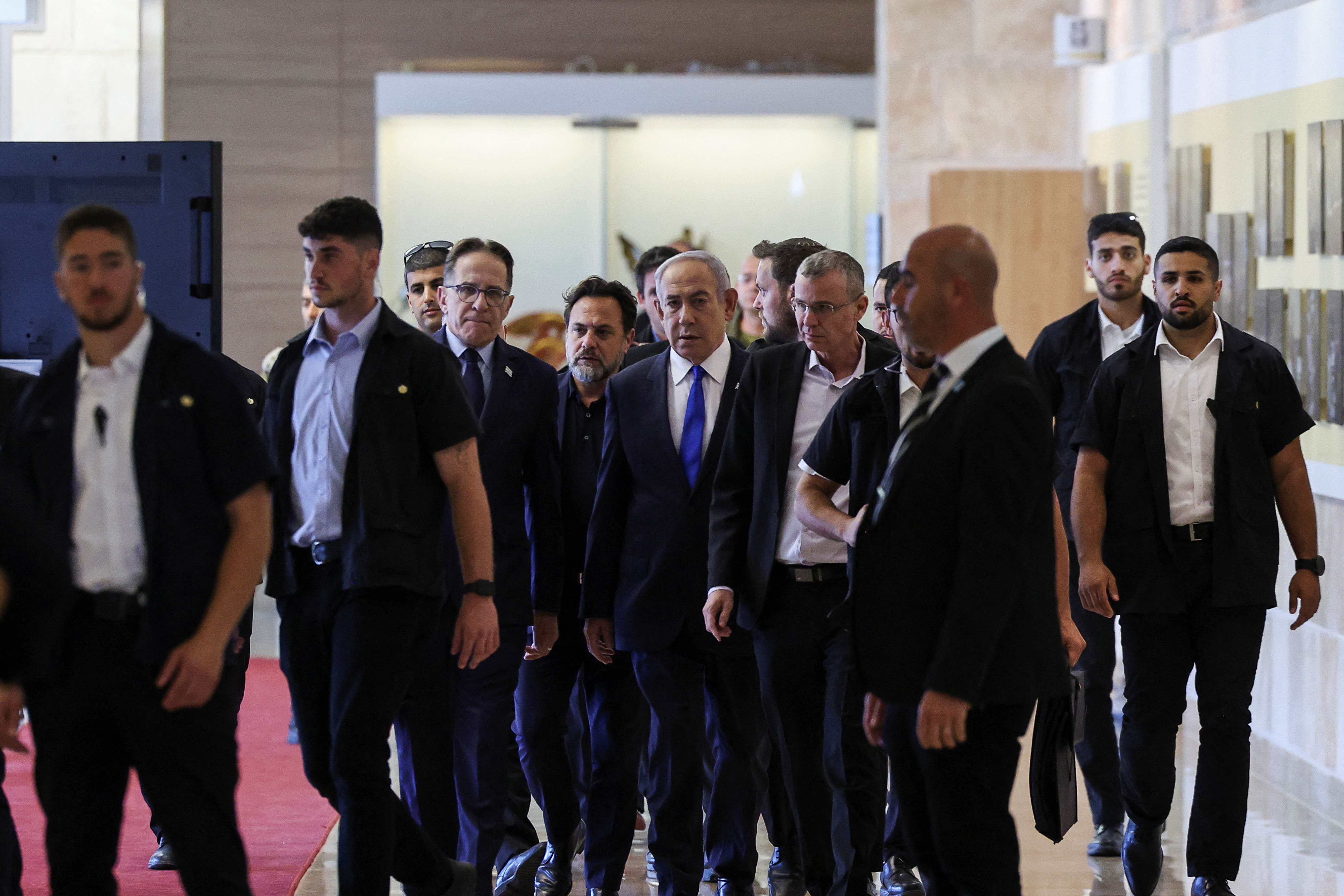 Israeli Prime Minister Netanyahu arrives to his Likud party faction meeting at the Knesset,in Jerusalem