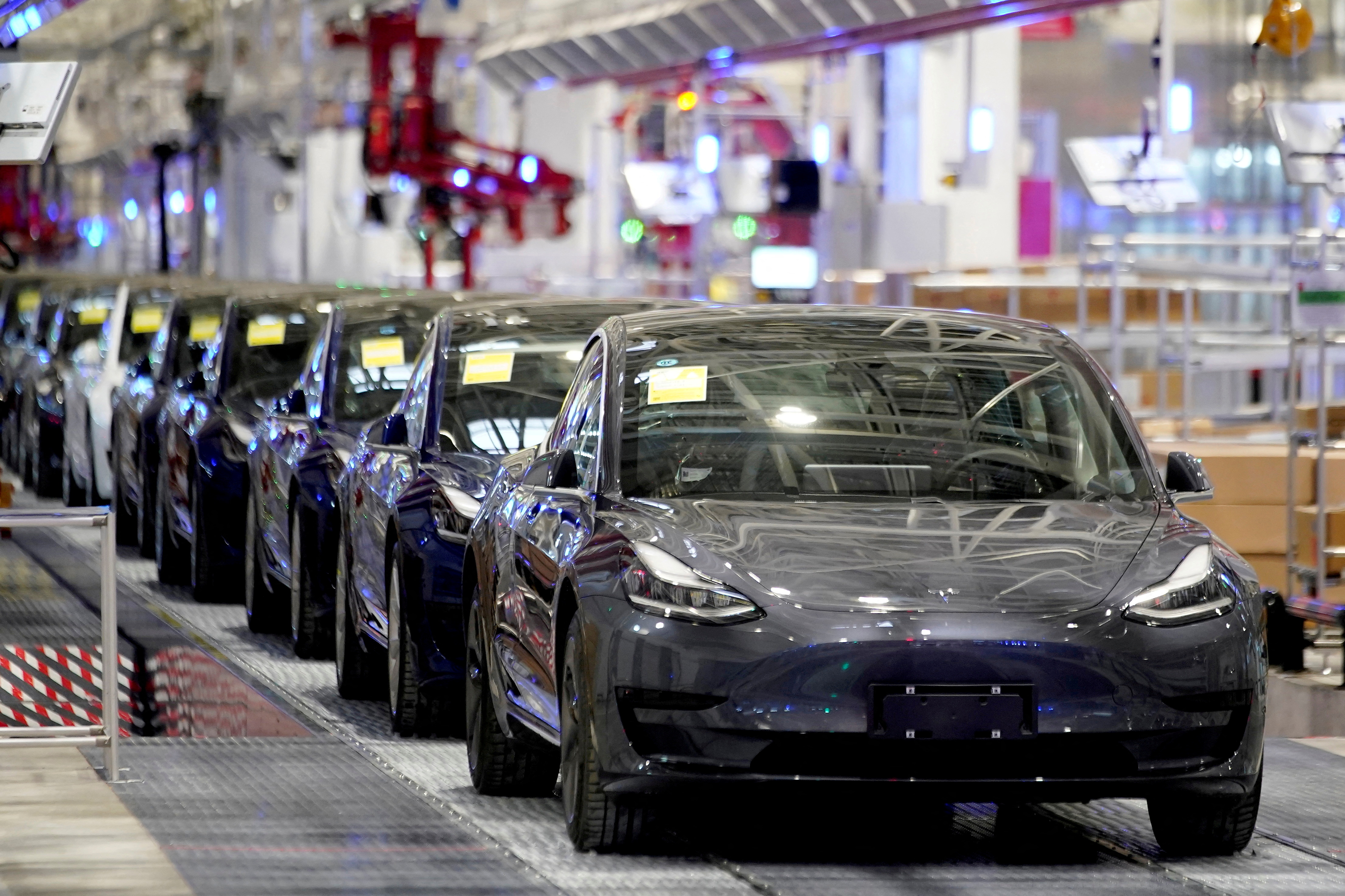 Tesla Model 3 vehicles are seen during a delivery event at the carmaker's factory in Shanghai, China