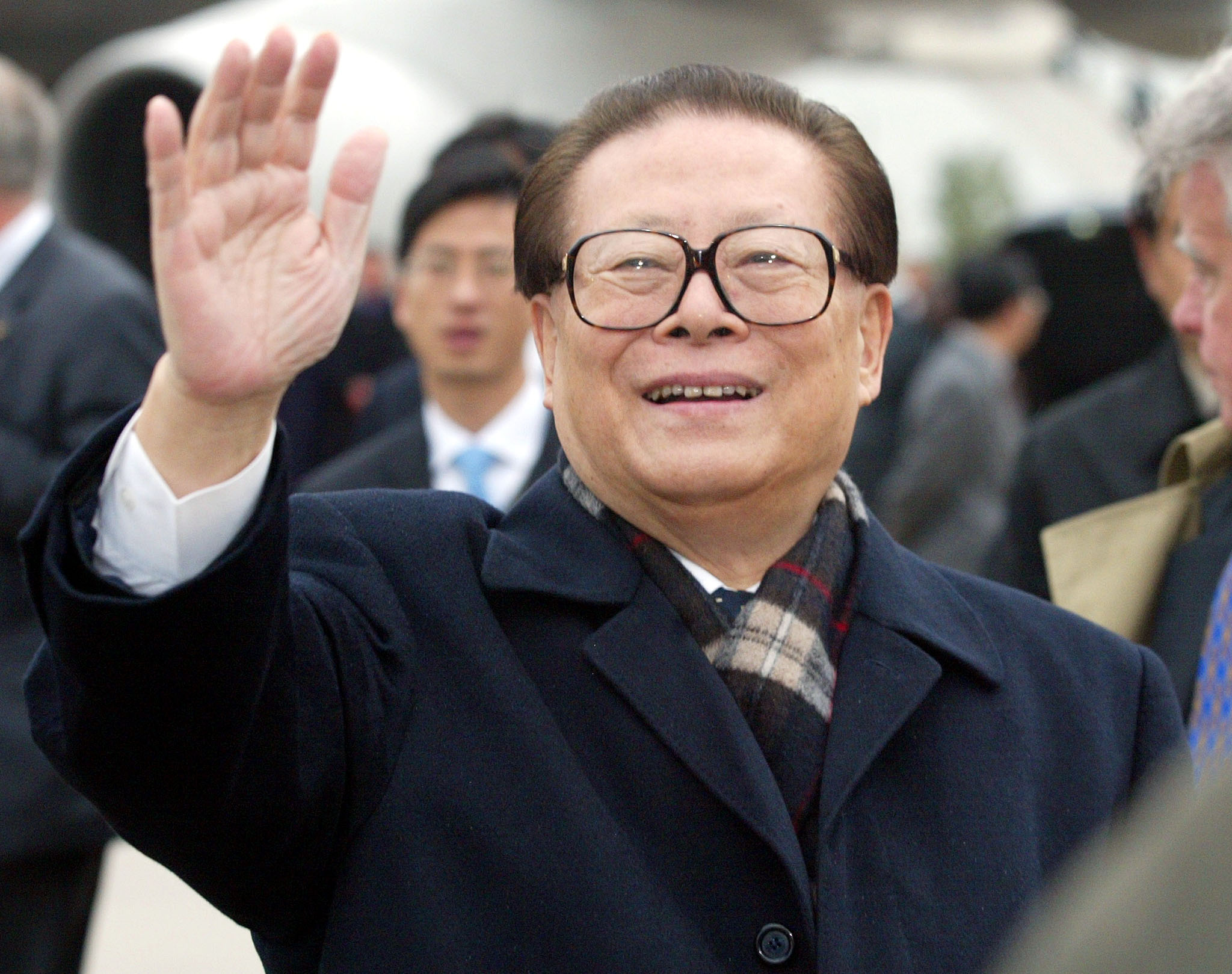 CHINESE PRESIDENT JIANG ZEMIN WAVES TO SUPPORTERS.