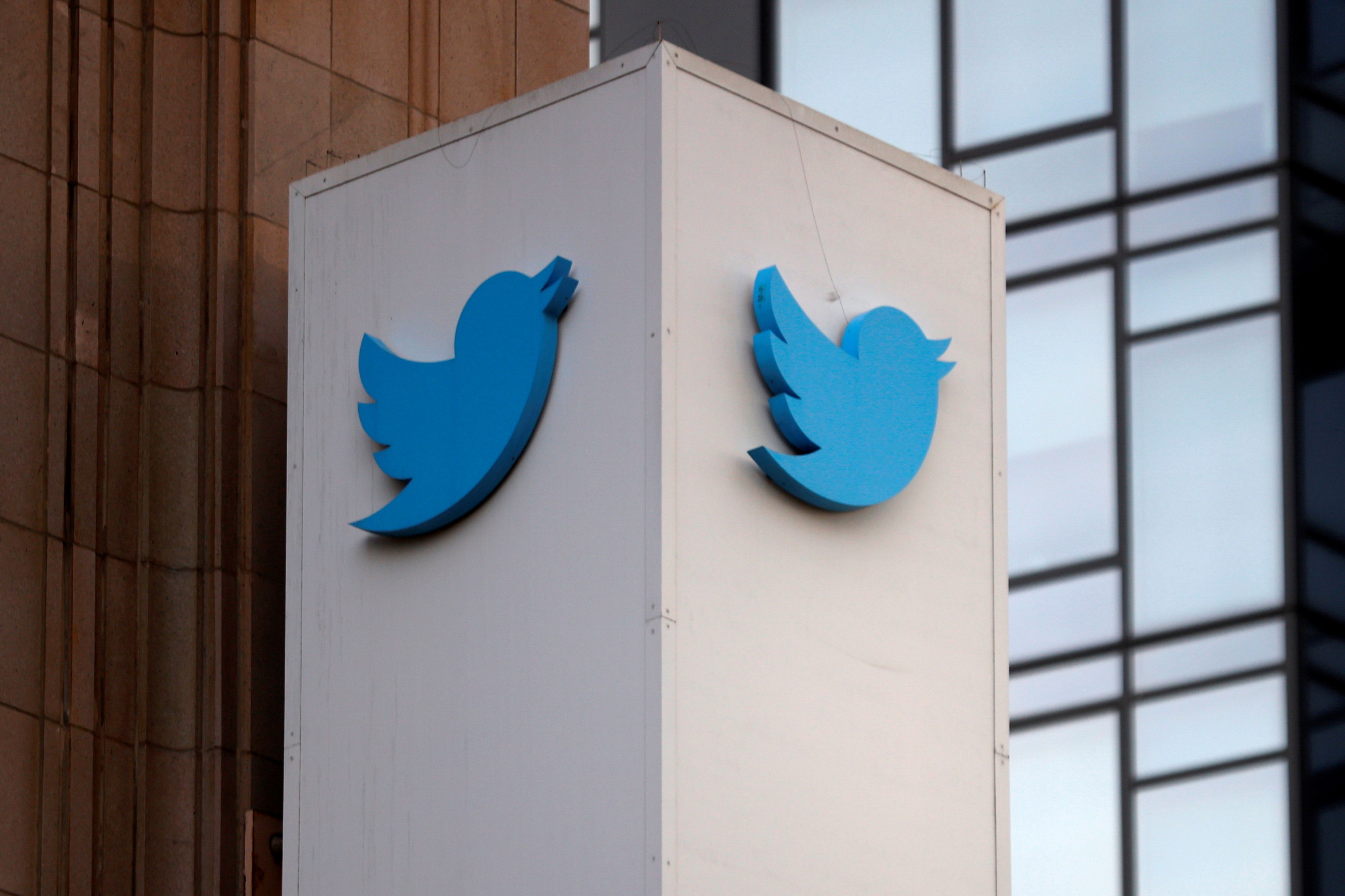 The Twitter logo is seen outside the company headquarters in San Francisco