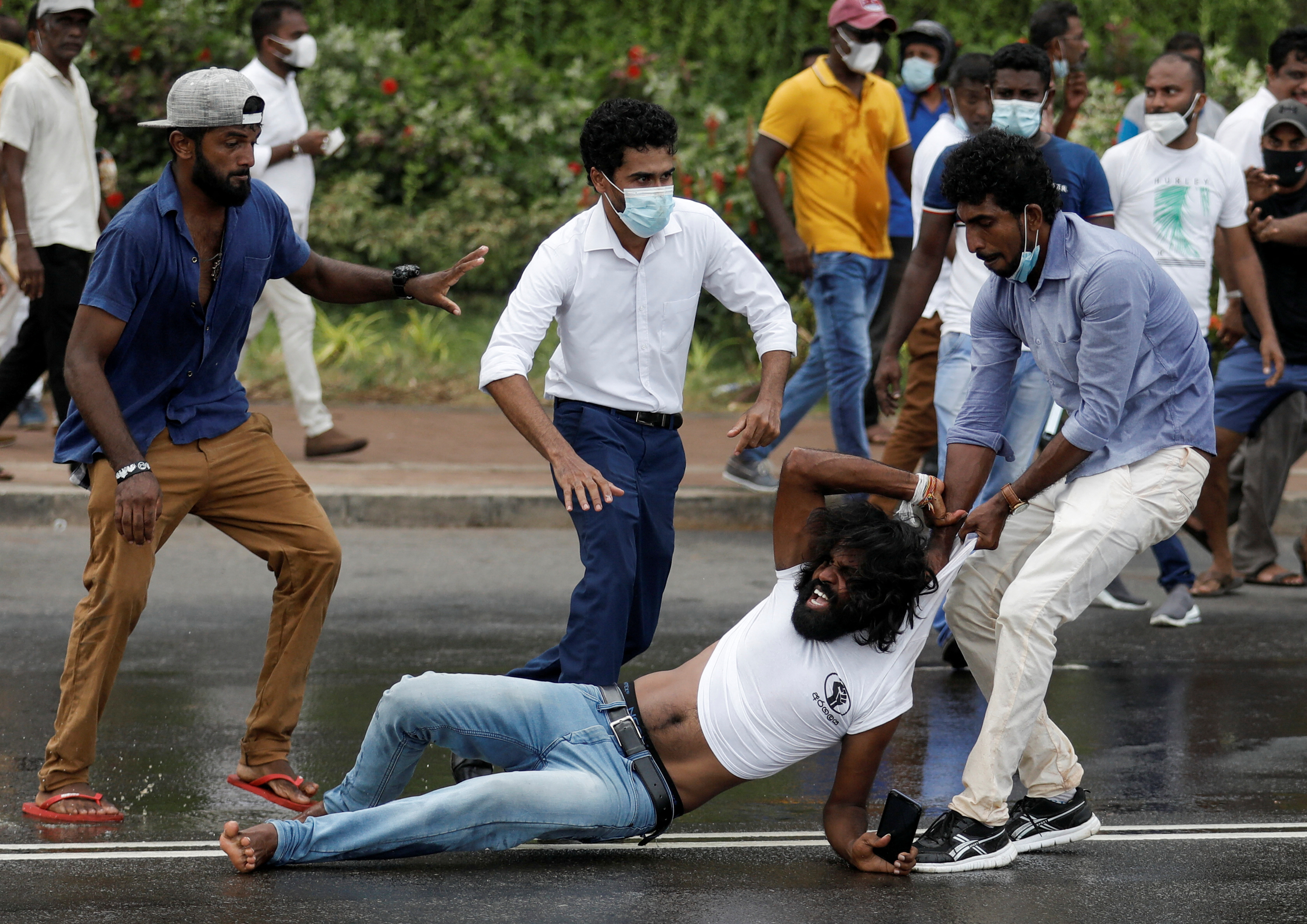 Sri Lanka's ruling party supporters storm anti-government protest camp, in Colombo