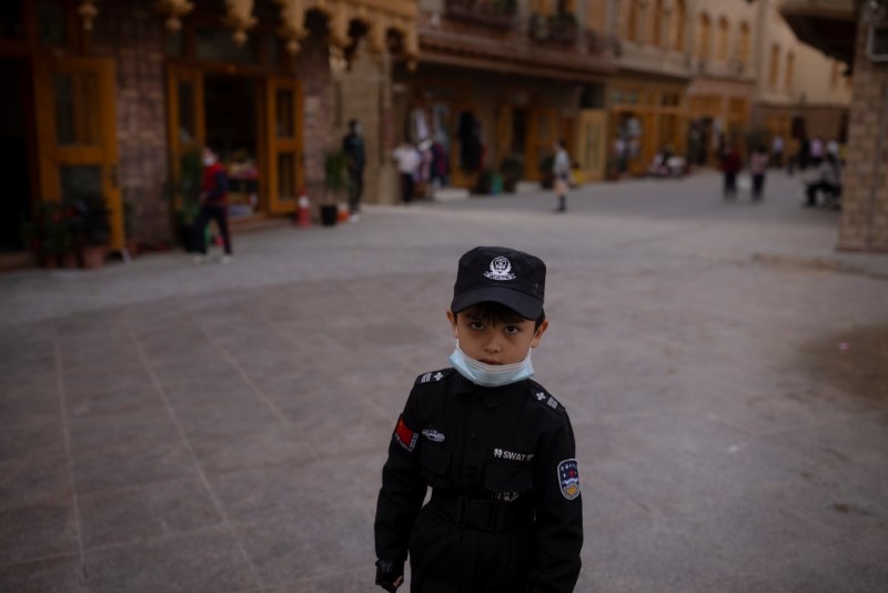 The Wider Image: In China's new Xinjiang: patriotic tourism, police and propaganda