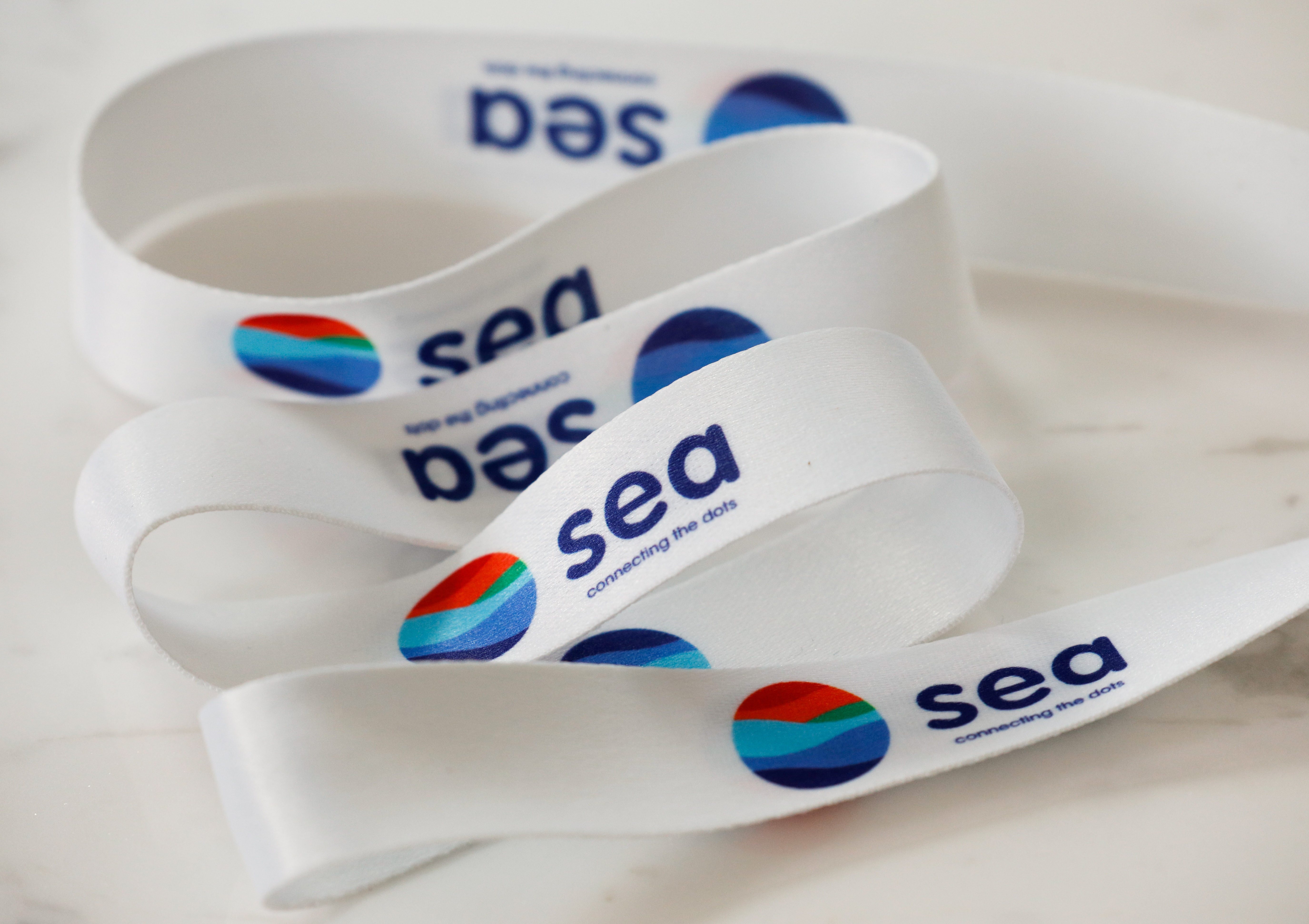 A lanyard showing logos of Southeast Asian e-commerce and gaming group Sea Ltd is pictured at their office in Singapore