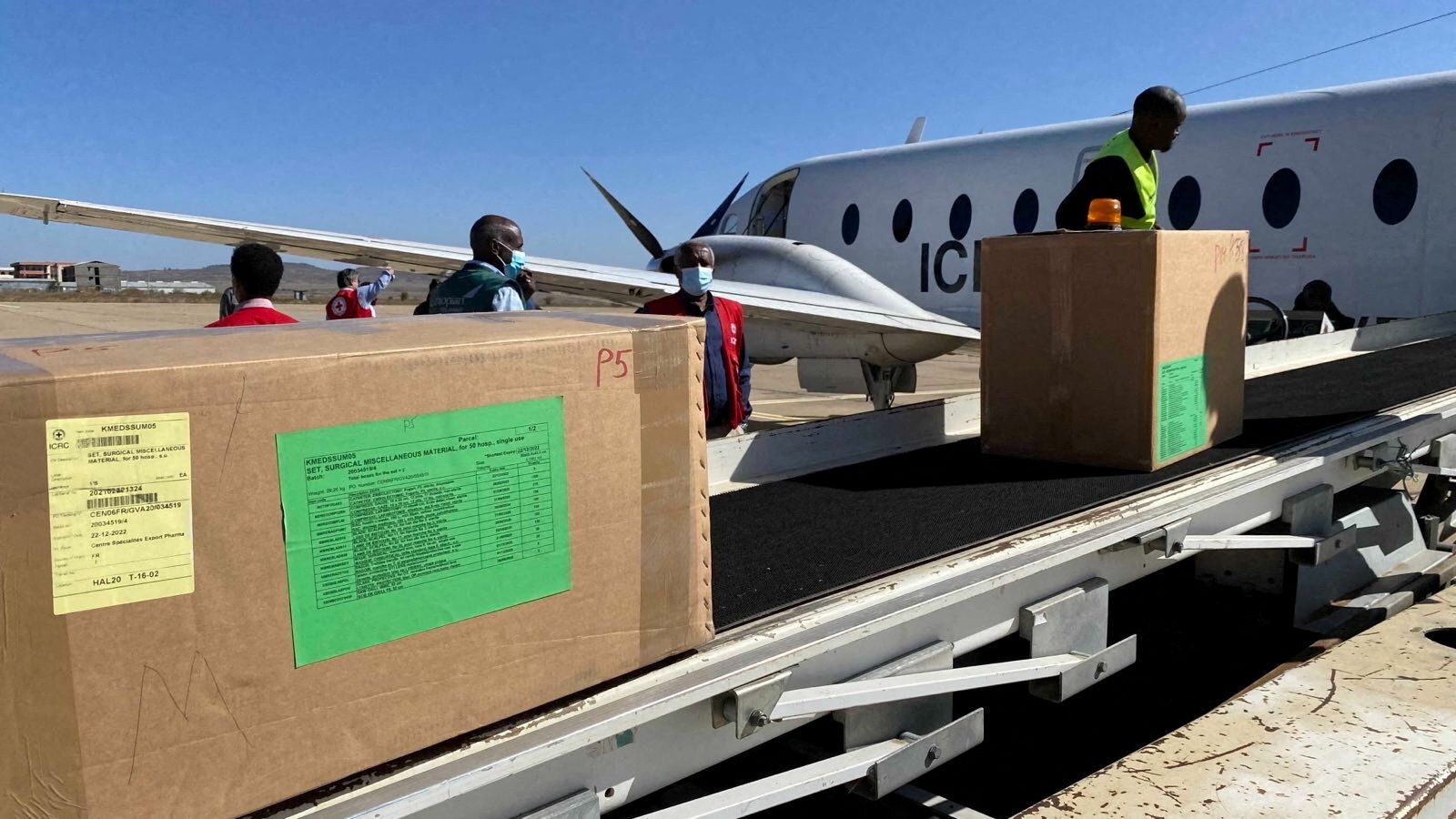 Workers from the International Committee of the Red Cross (ICRC) deliver lifesaving medical supplies into Mekelle, in Tigray region