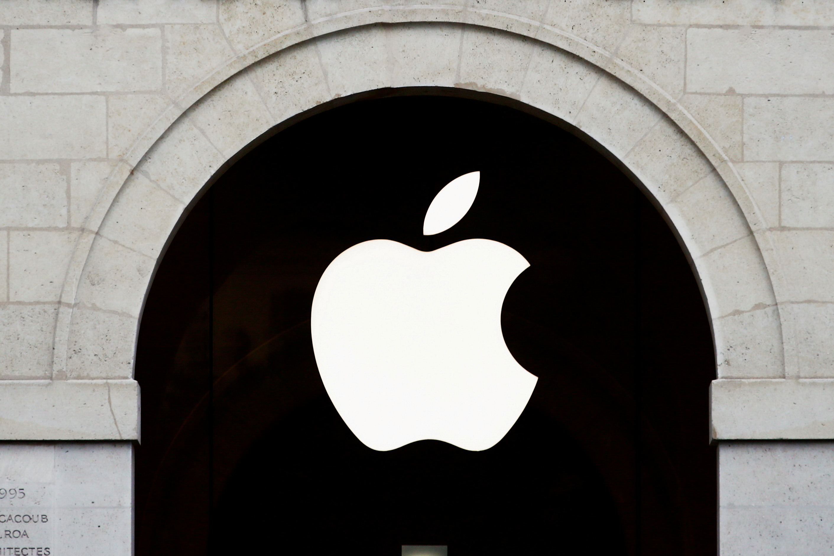 Apple logo is seen on the Apple store at The Marche Saint Germain in Paris, France July 15, 2020.  REUTERS/Gonzalo Fuentes/File Photo