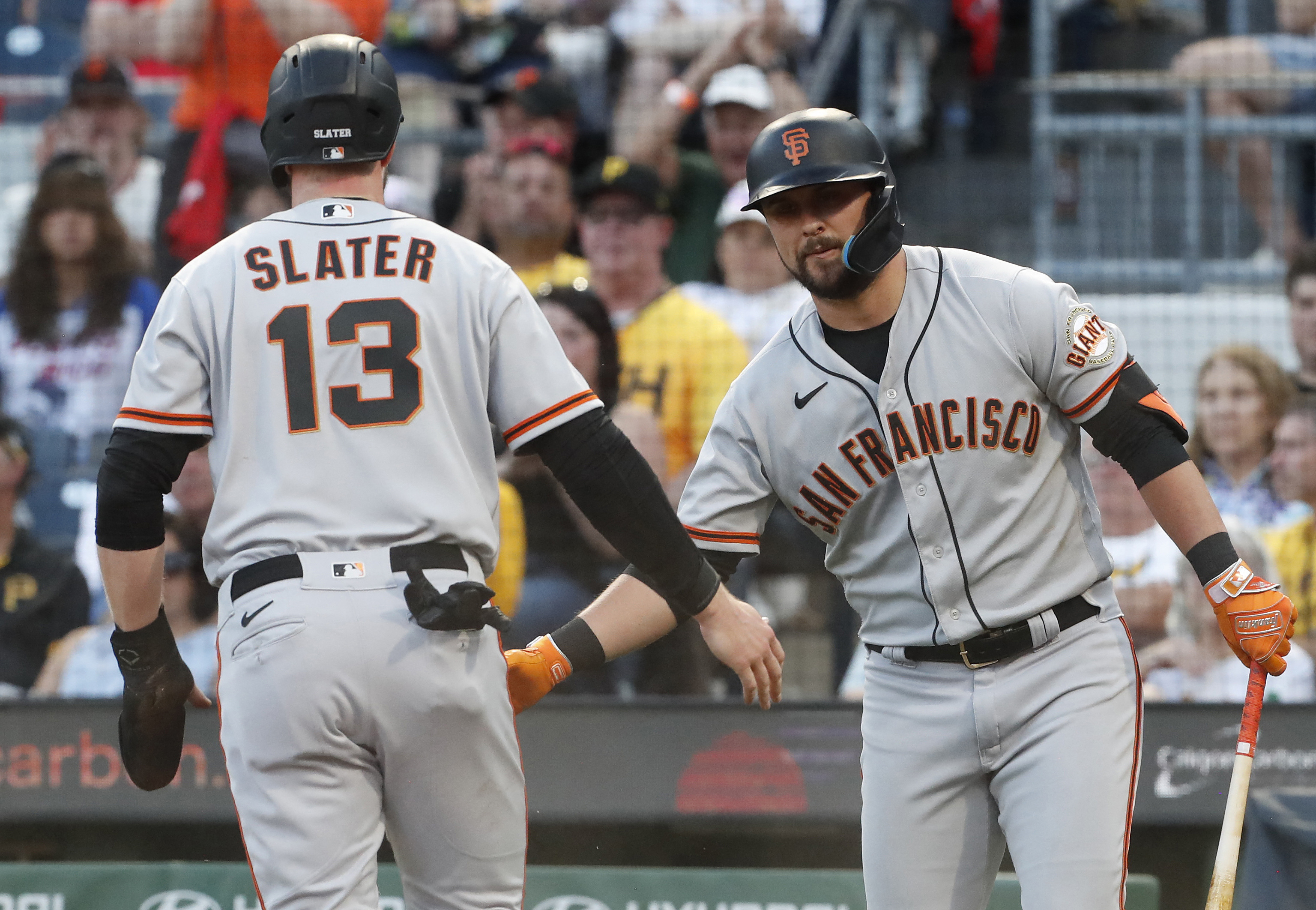 San Francisco Giants' Austin Slater (13), Luis Matos (29), and