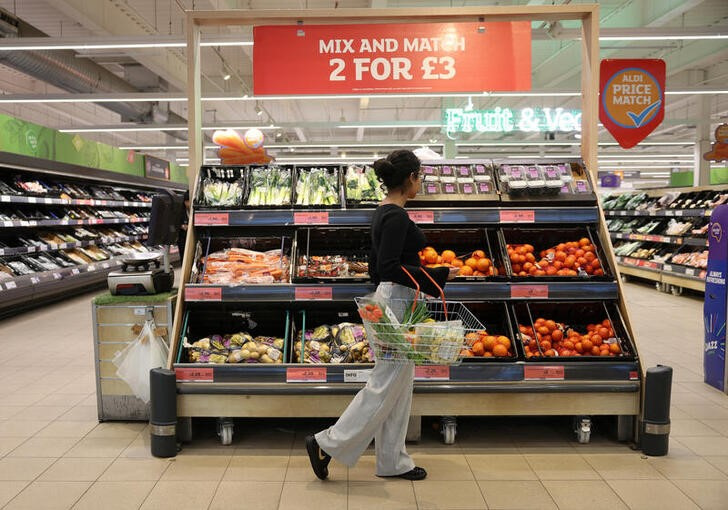 A customer shops in the fruit aisle inside a Sainsbury’s supermarket in London