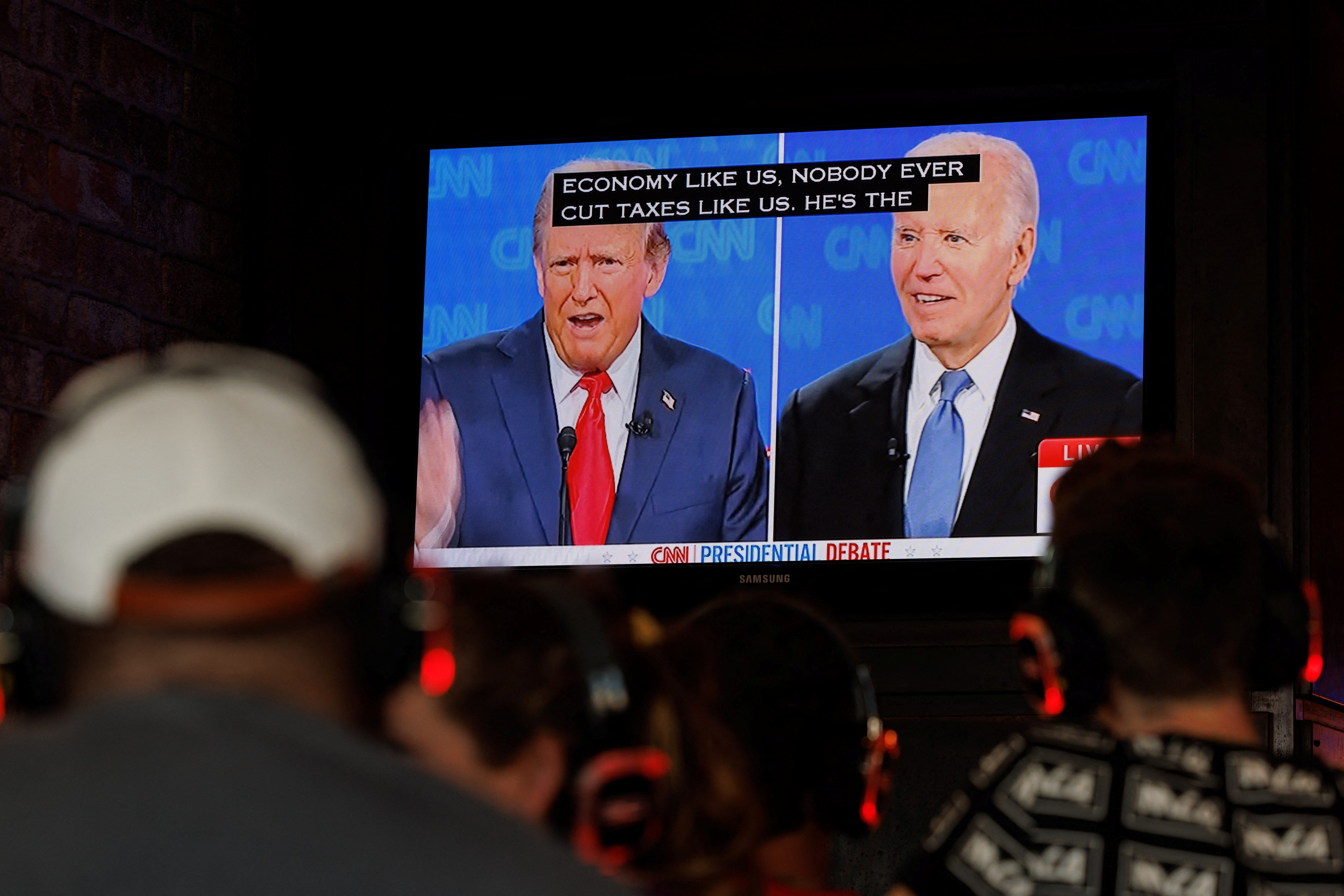 People watch presidential debate from tavern in California
