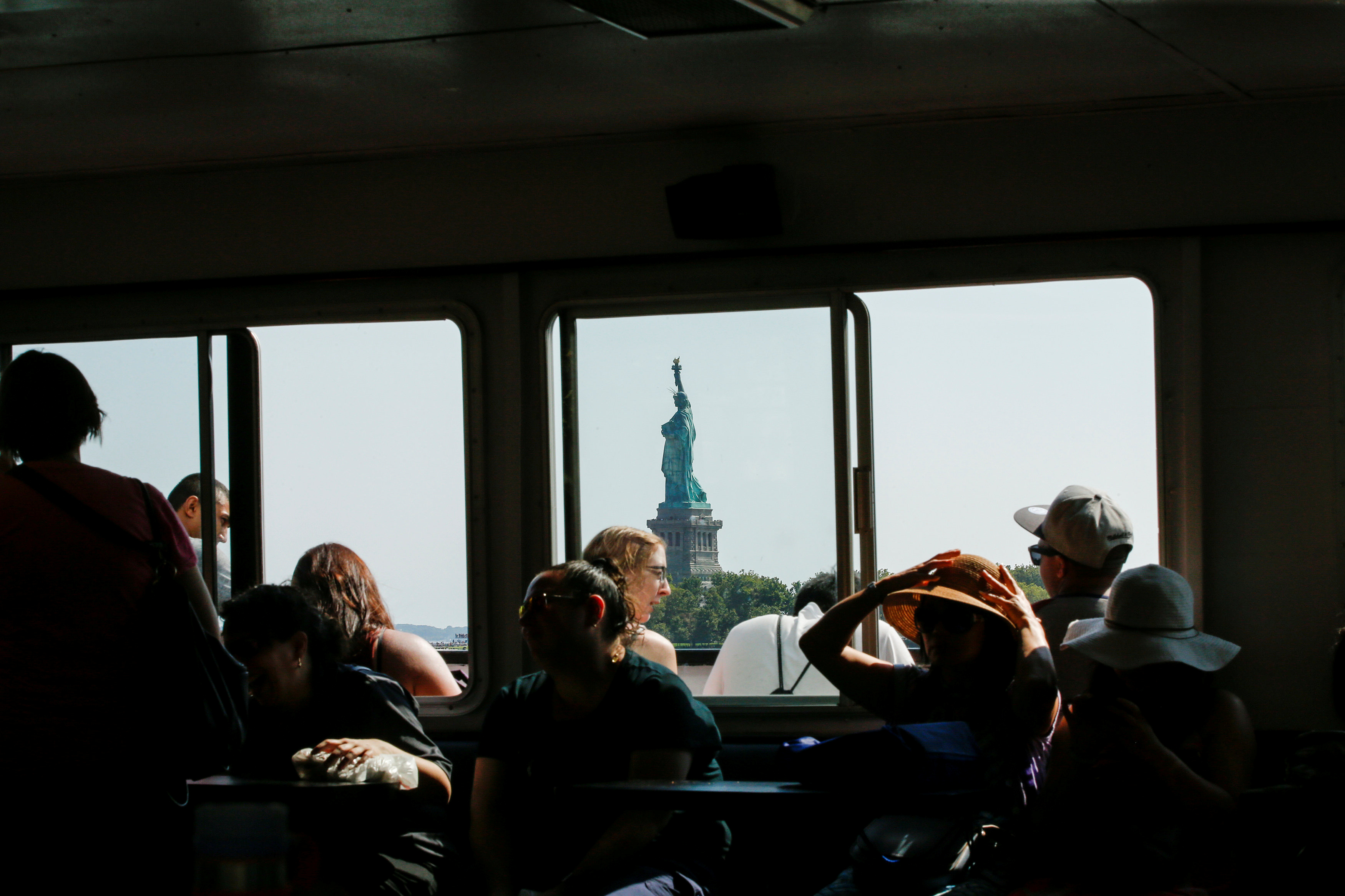 People take the ferry to visit the Liberty State Island in New York