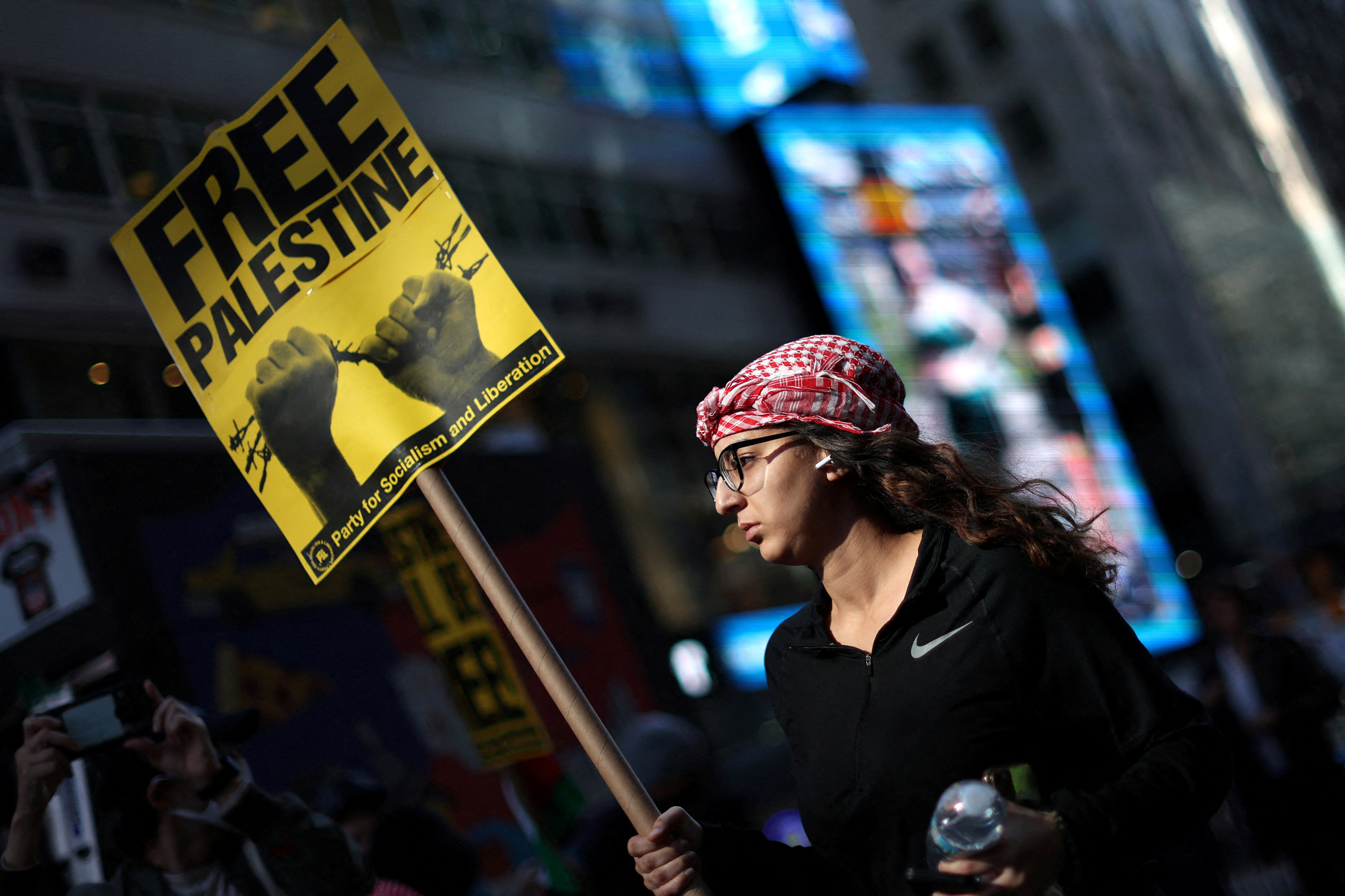 People attend a demonstration to express solidarity with Palestinians in Gaza in New York