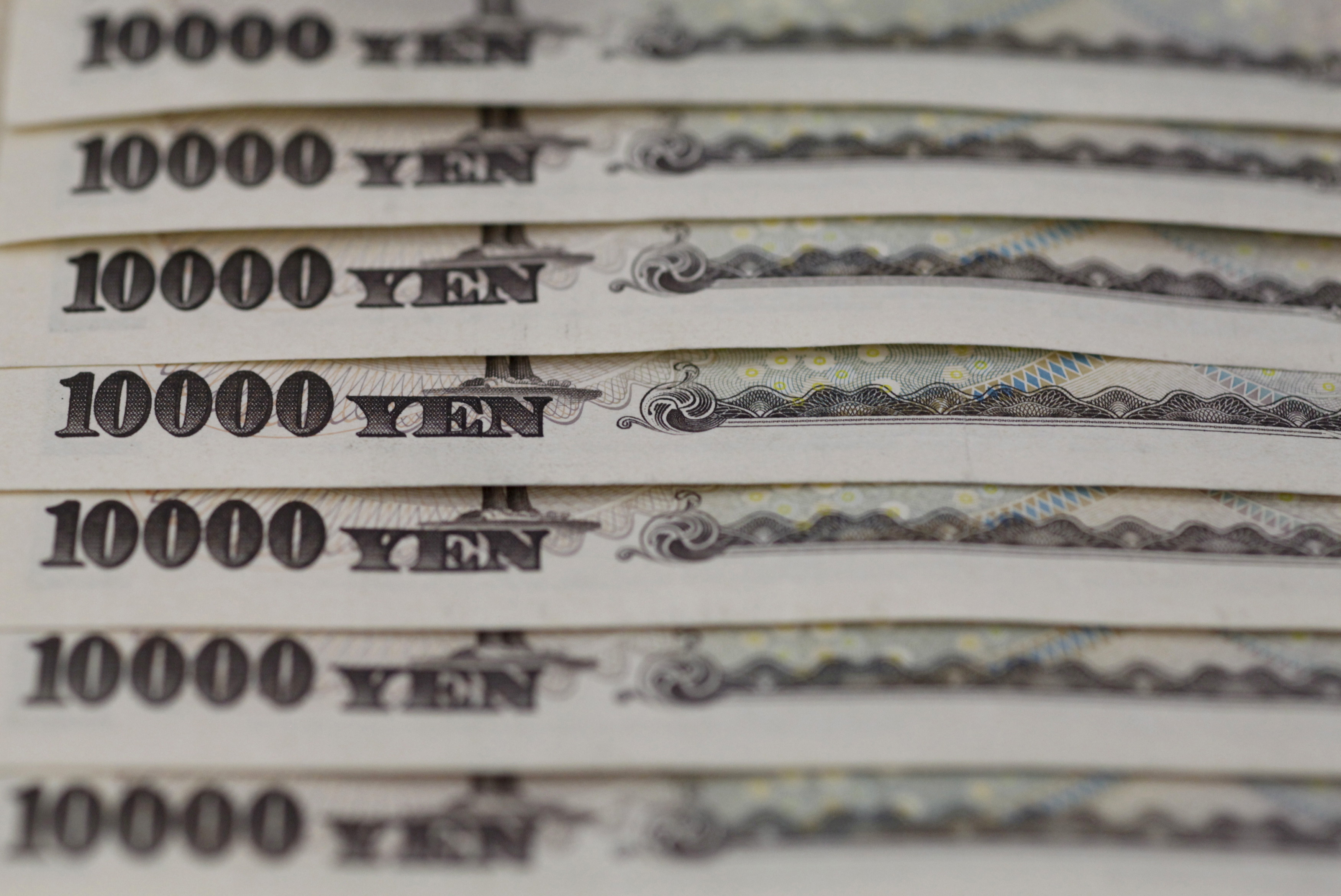 Japanese 10,000 yen notes line up in Tokyo, in this picture illustration