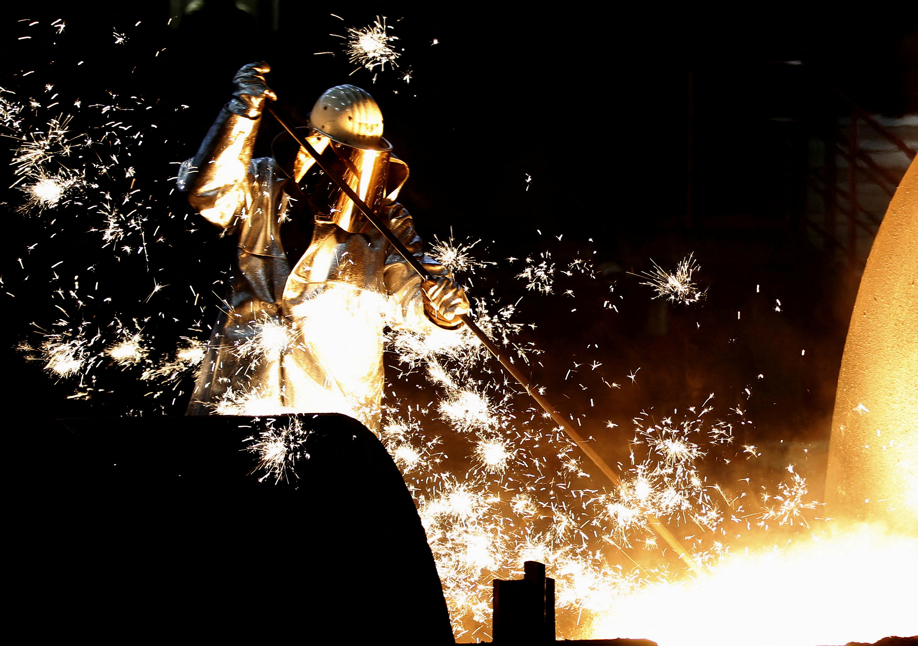 A German steelmaker ThyssenKrupp worker controls a blast furnace in Duisburg