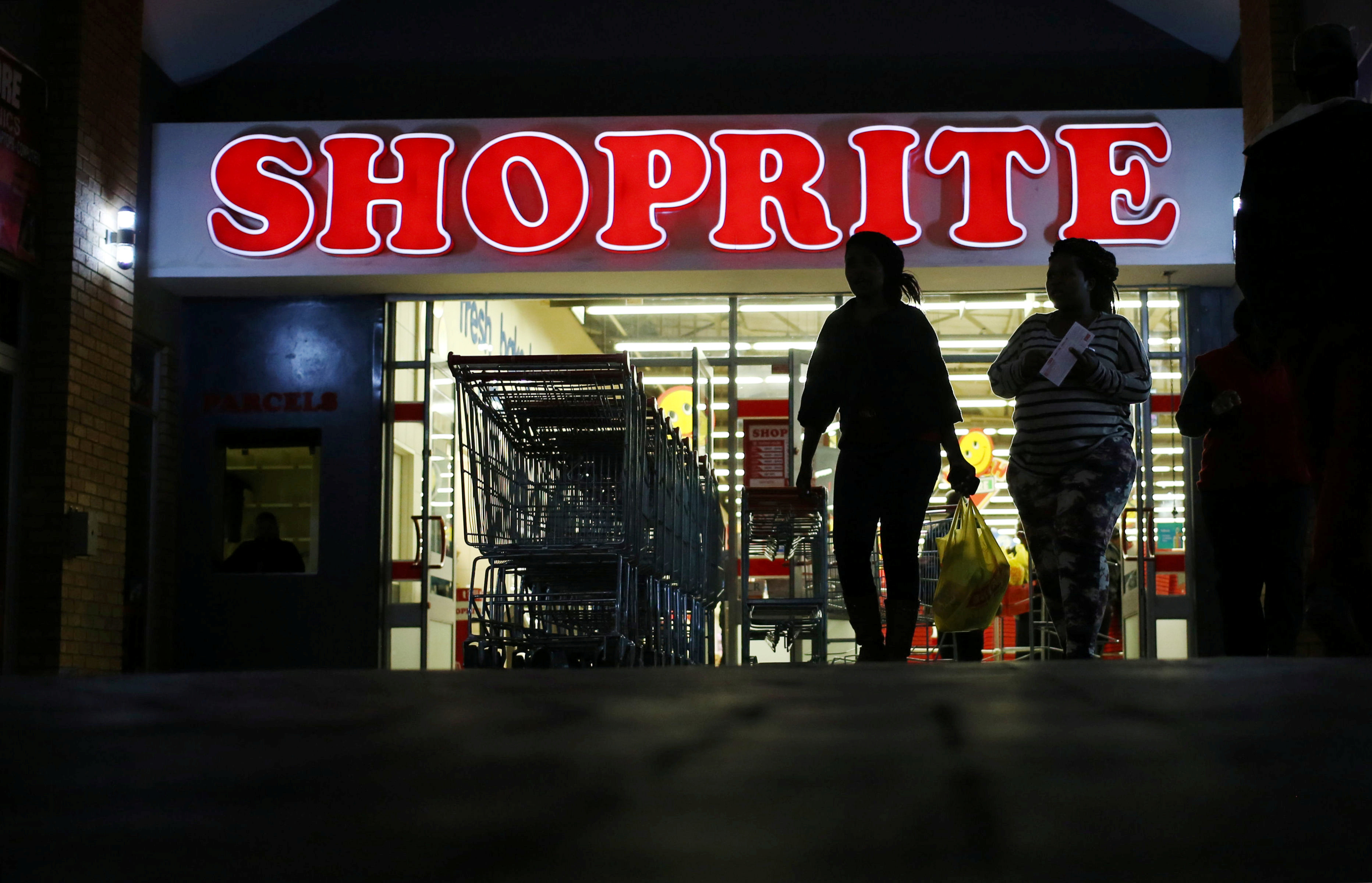 Shoppers leave the Shoprite store in Daveyton