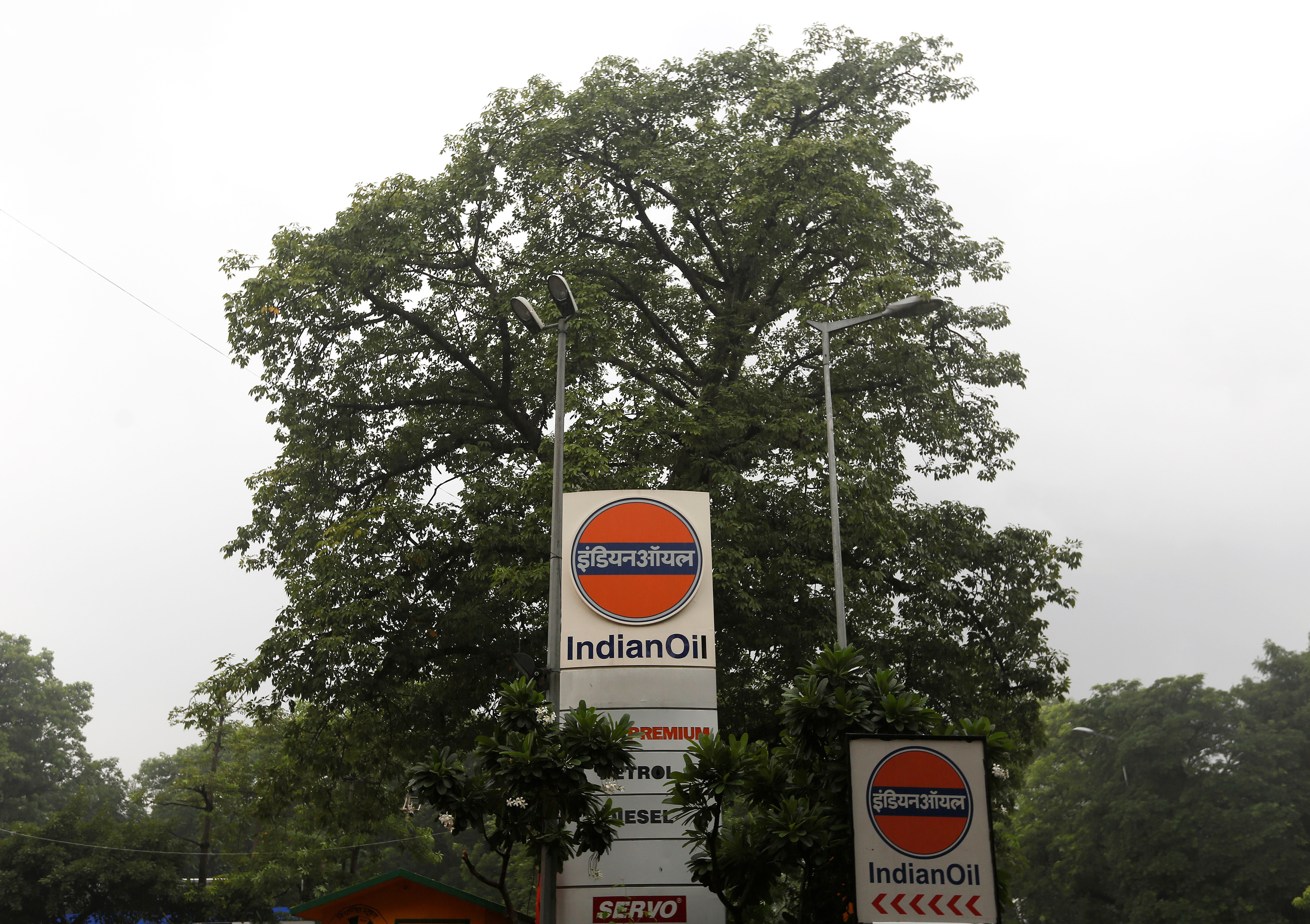 Logos of Indian Oil are pictured outside a fuel station in New Delhi
