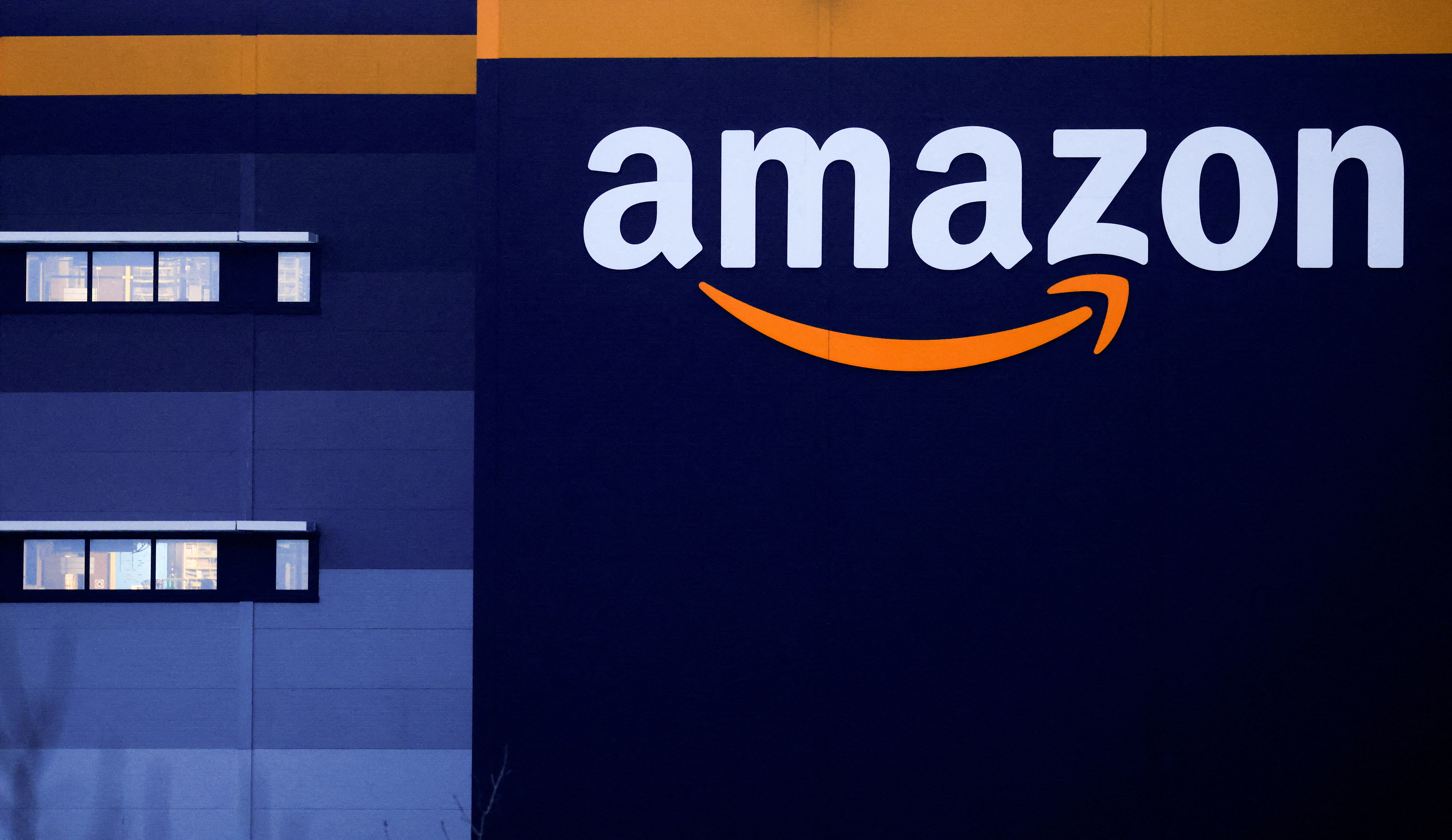 FILE PHOTO: Amazon logo at the company's logistics center in Bretigny-sur-Orge