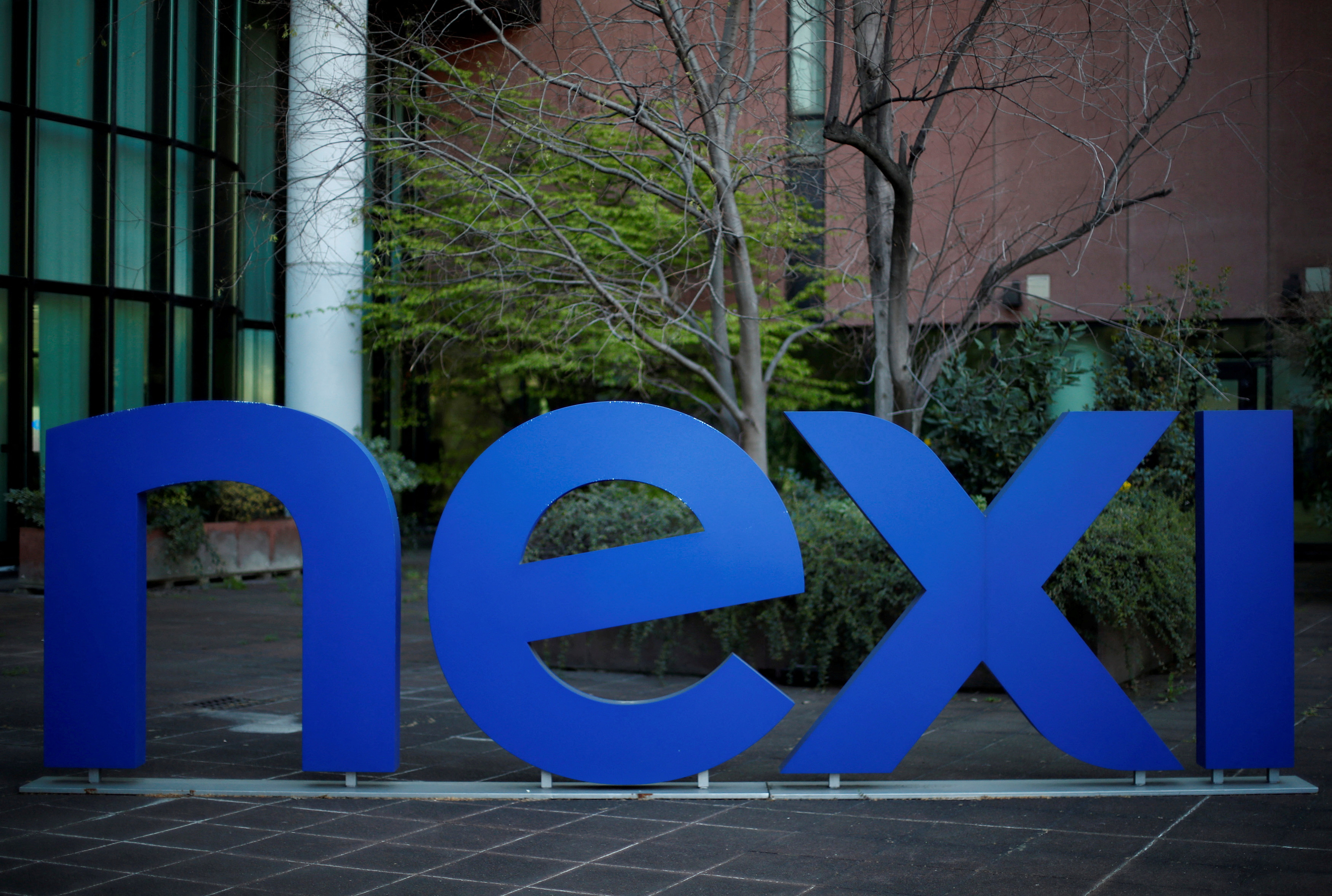 The logo of Italian payments group Nexi is pictured outside their headquarters in Milan