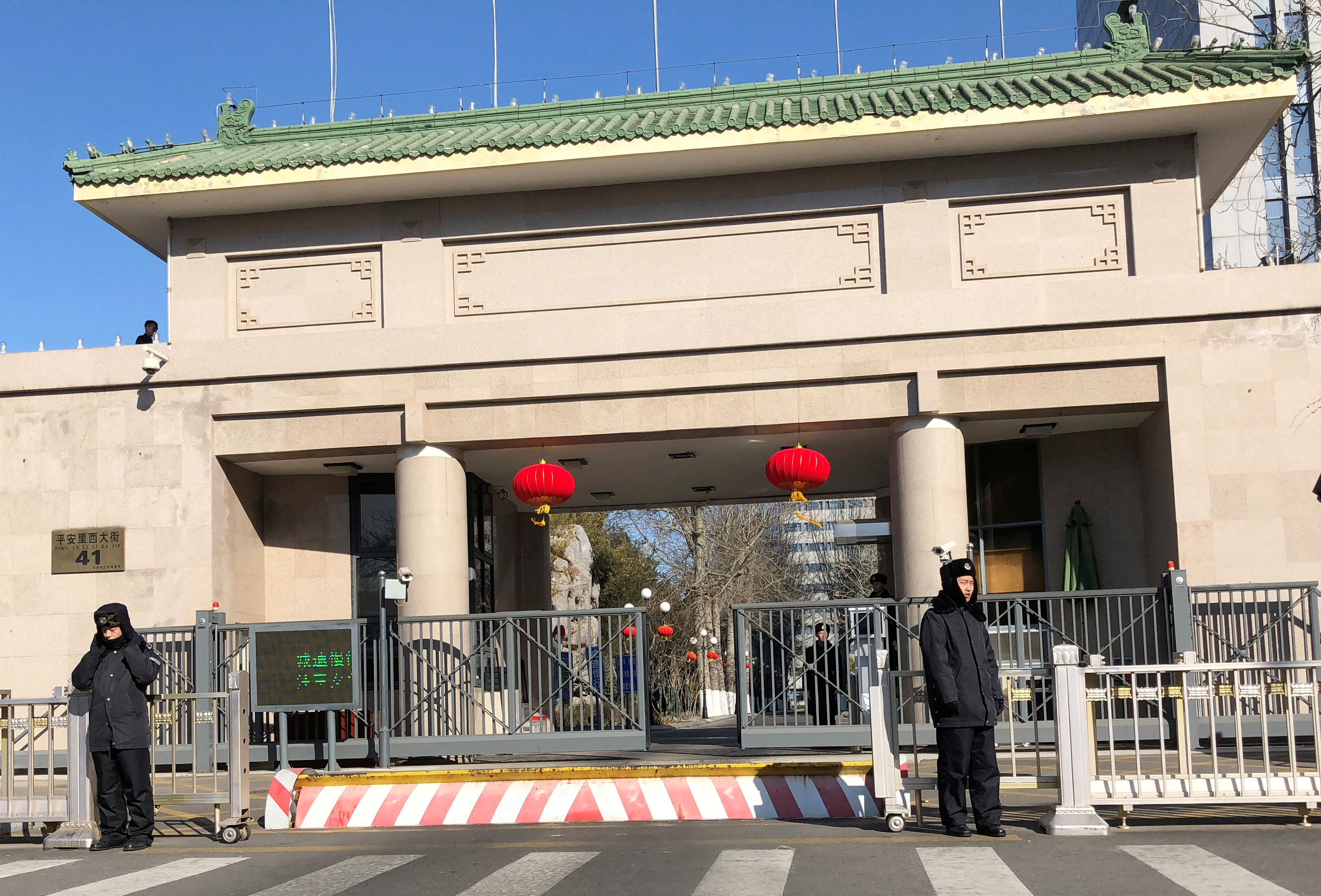 Security personnel stand guard at headquarters of the Central Commission for Discipline Inspection of the Communist Party of China in Beijing