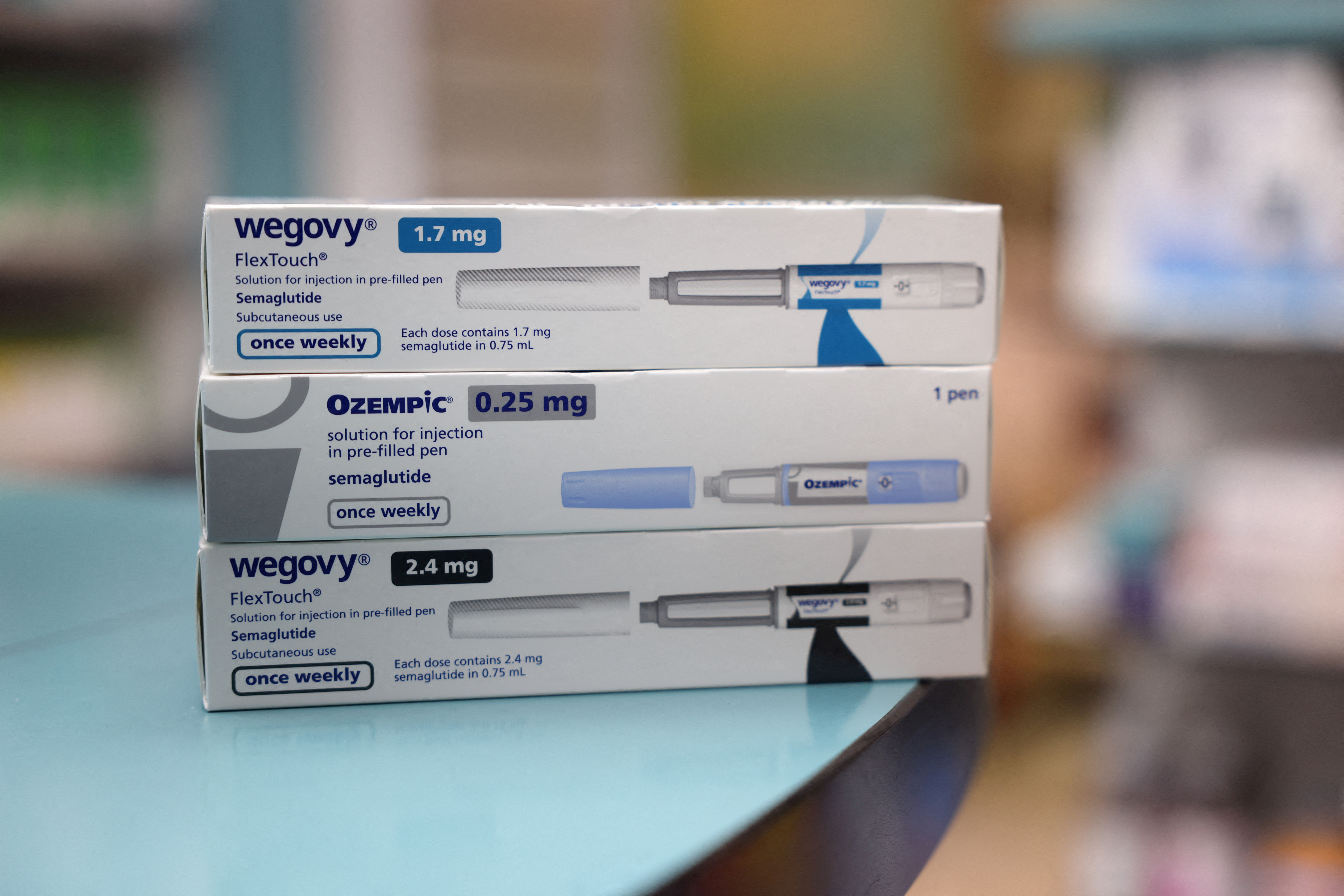 Boxes of Ozempic and Wegovy made by Novo Nordisk are seen at a pharmacy in London