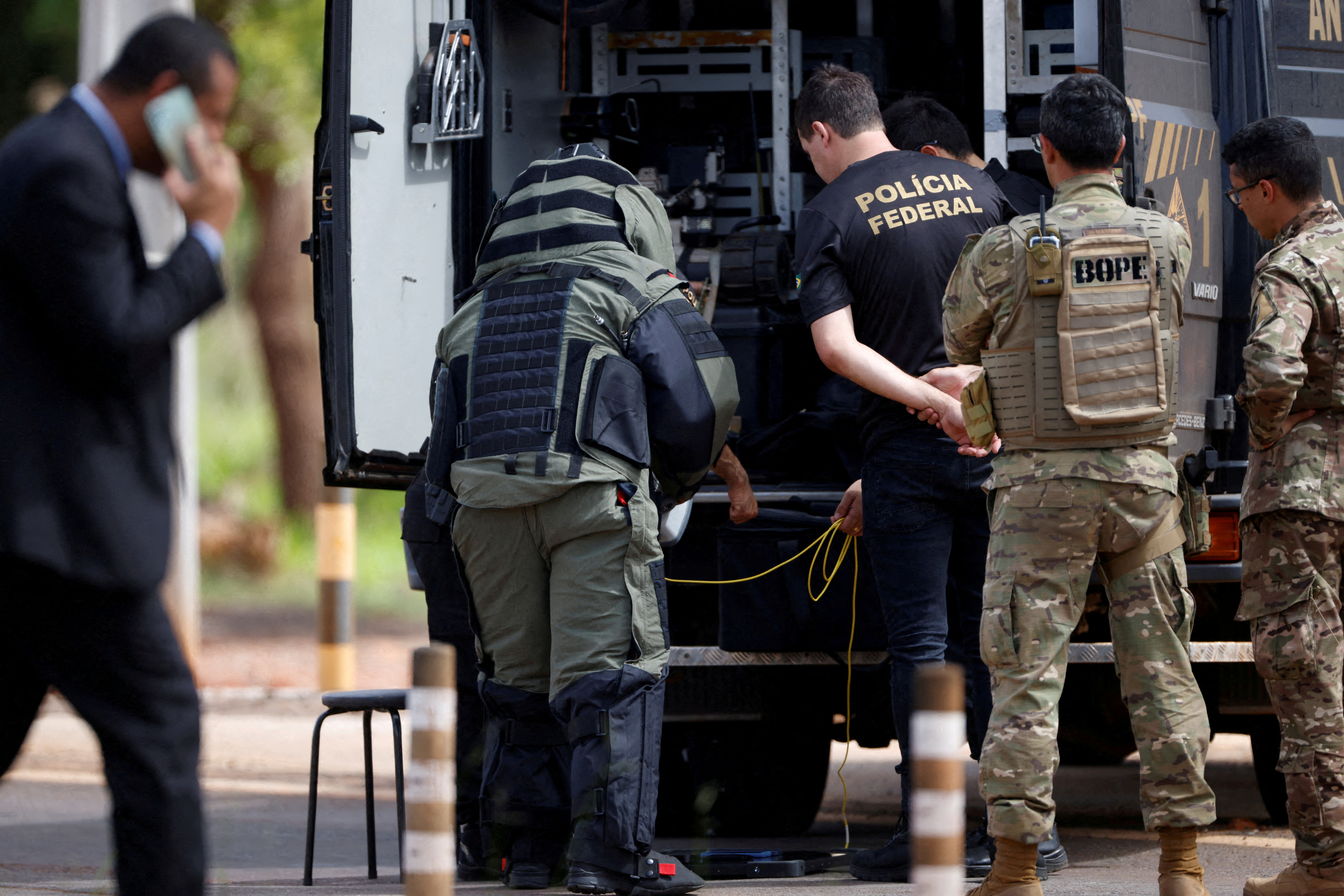 A robot of the federal police bomb squad is seen near what is believed to be an explosive artifact in Brasilia, Brazil