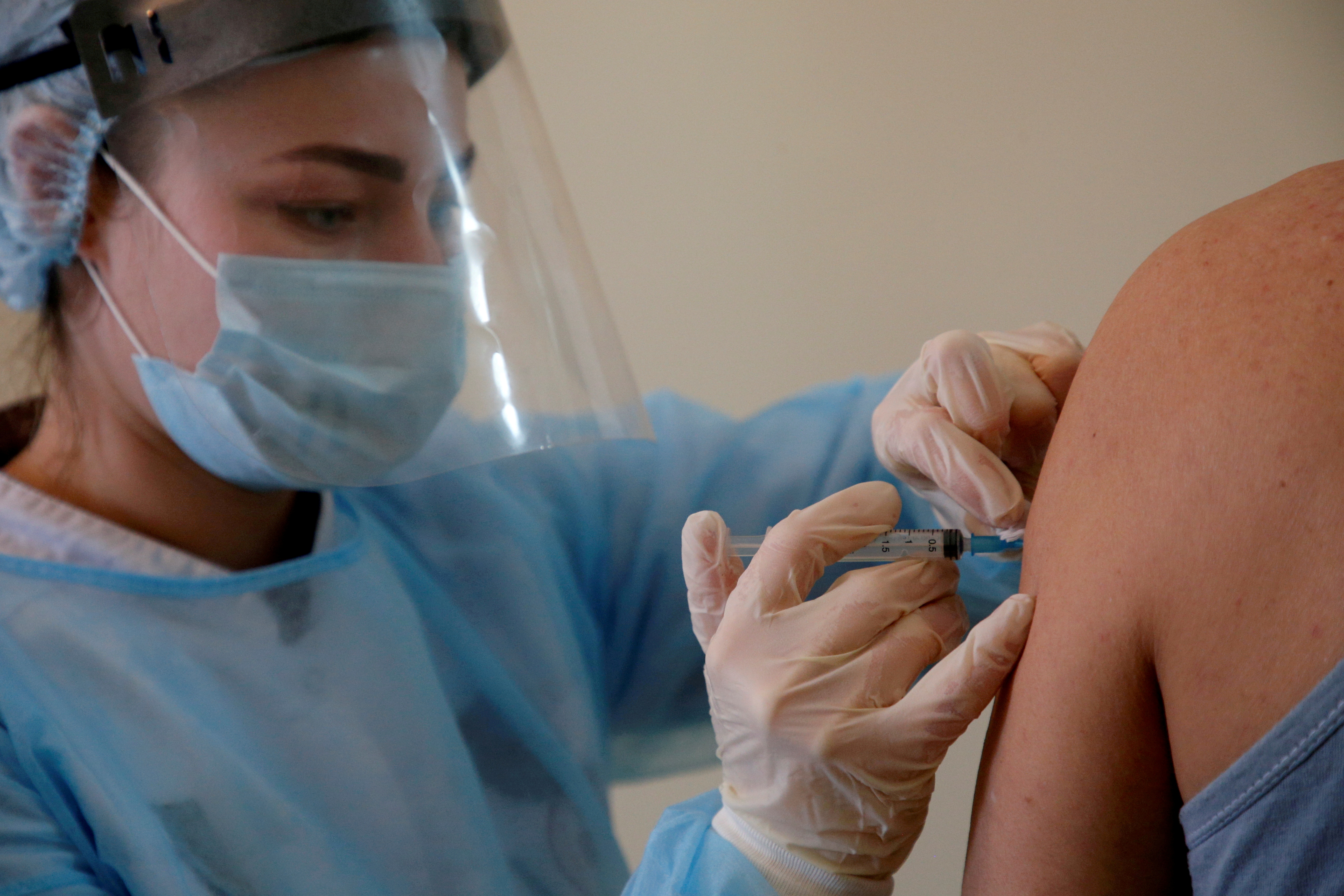 A person receives an injection with Sputnik V (Gam-COVID-Vac) vaccine against the coronavirus disease (COVID-19) in Donskoye