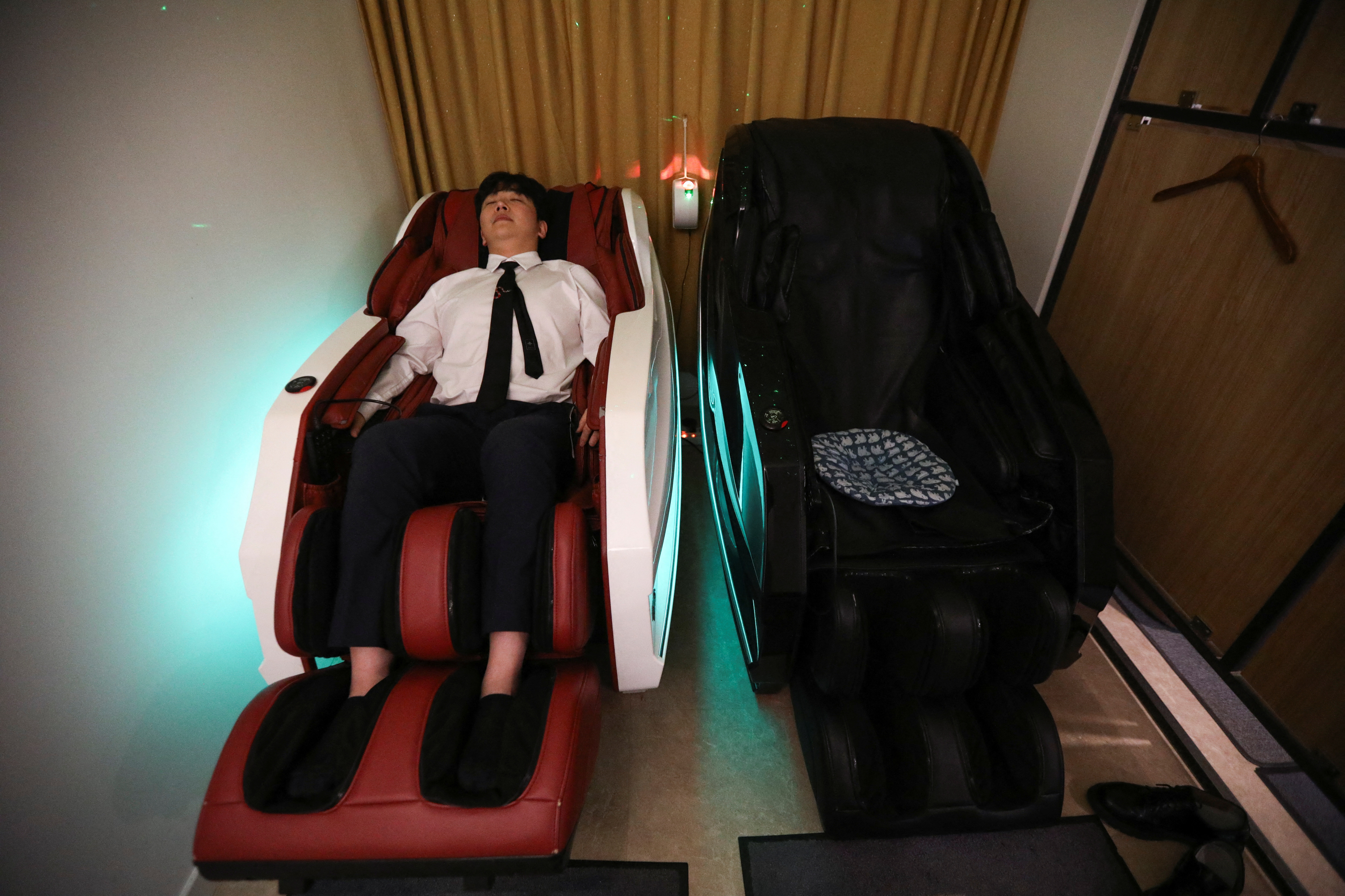 Office worker Park Sang-seon rests at a healing sleep cafe in Seoul