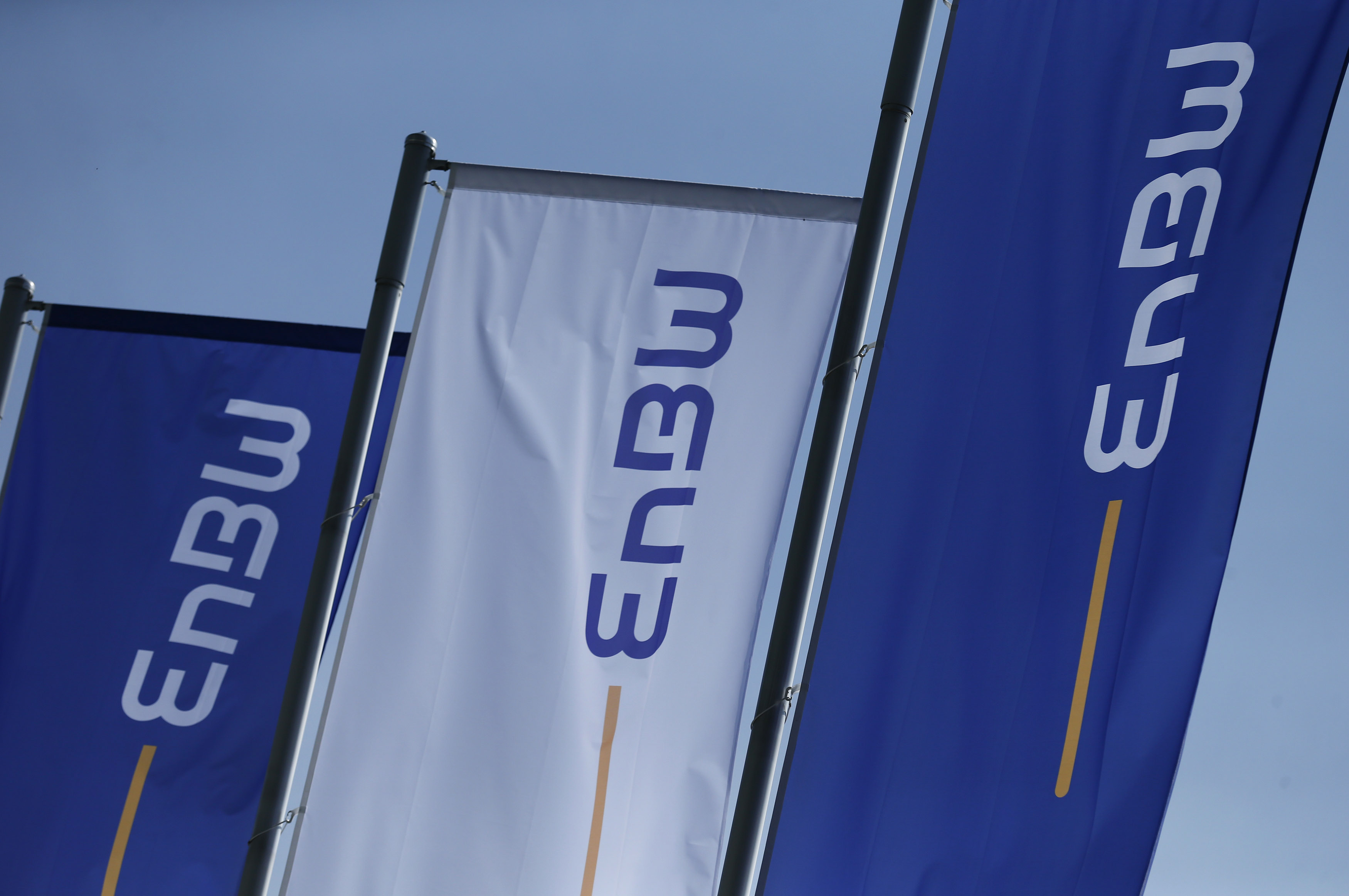 Flags of German power supplier EnBW Energie Baden-Wuertemberg AG are pictured at the company's headquarters in Karlsruhe
