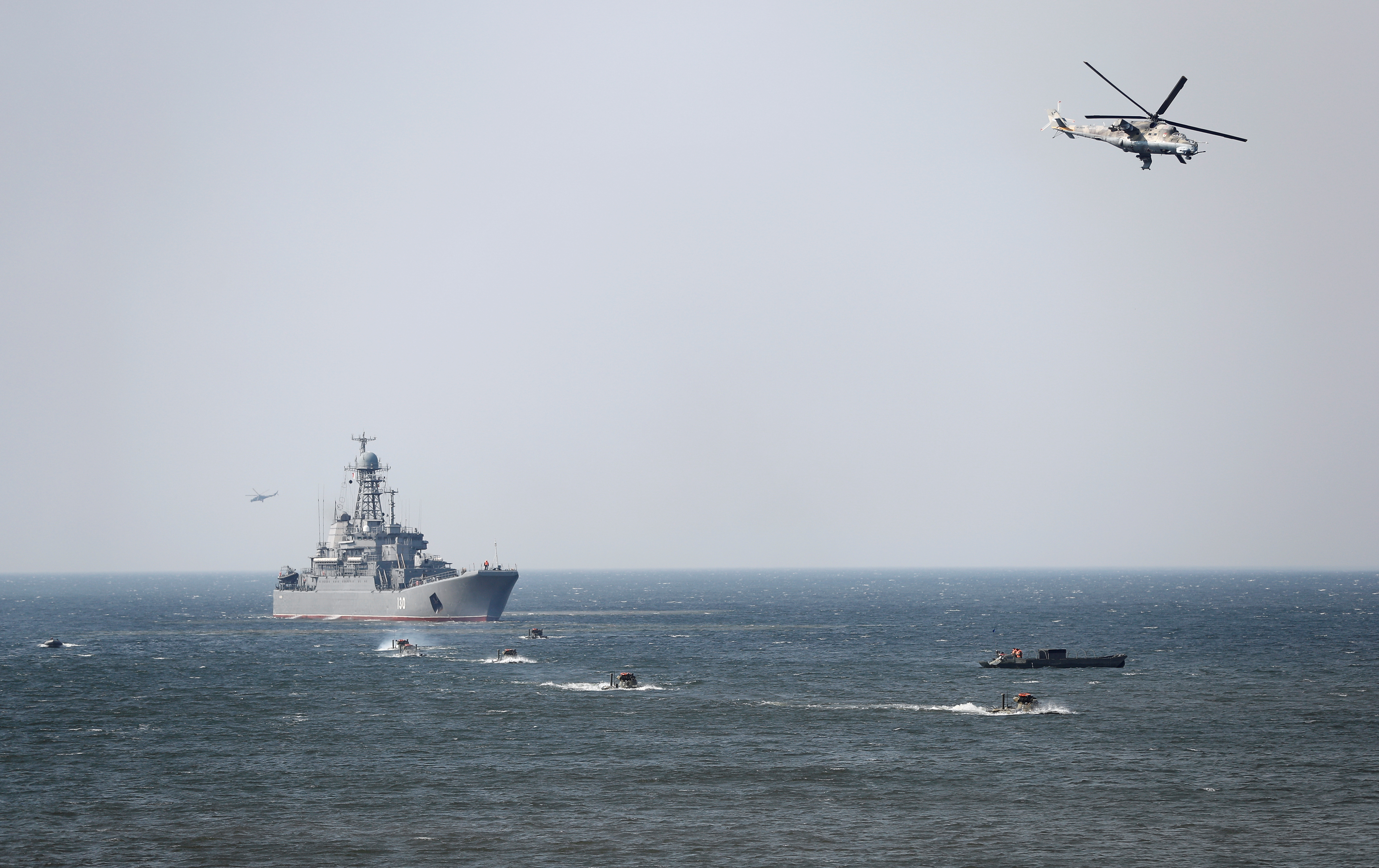An amphibious assault ship, armored personnel carriers and helicopters are seen during military exercises of the Russian Navy in Kaliningrad Region