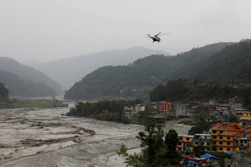 Flash floods kill 10 people in Bhutan, seven missing in Nepal | Reuters