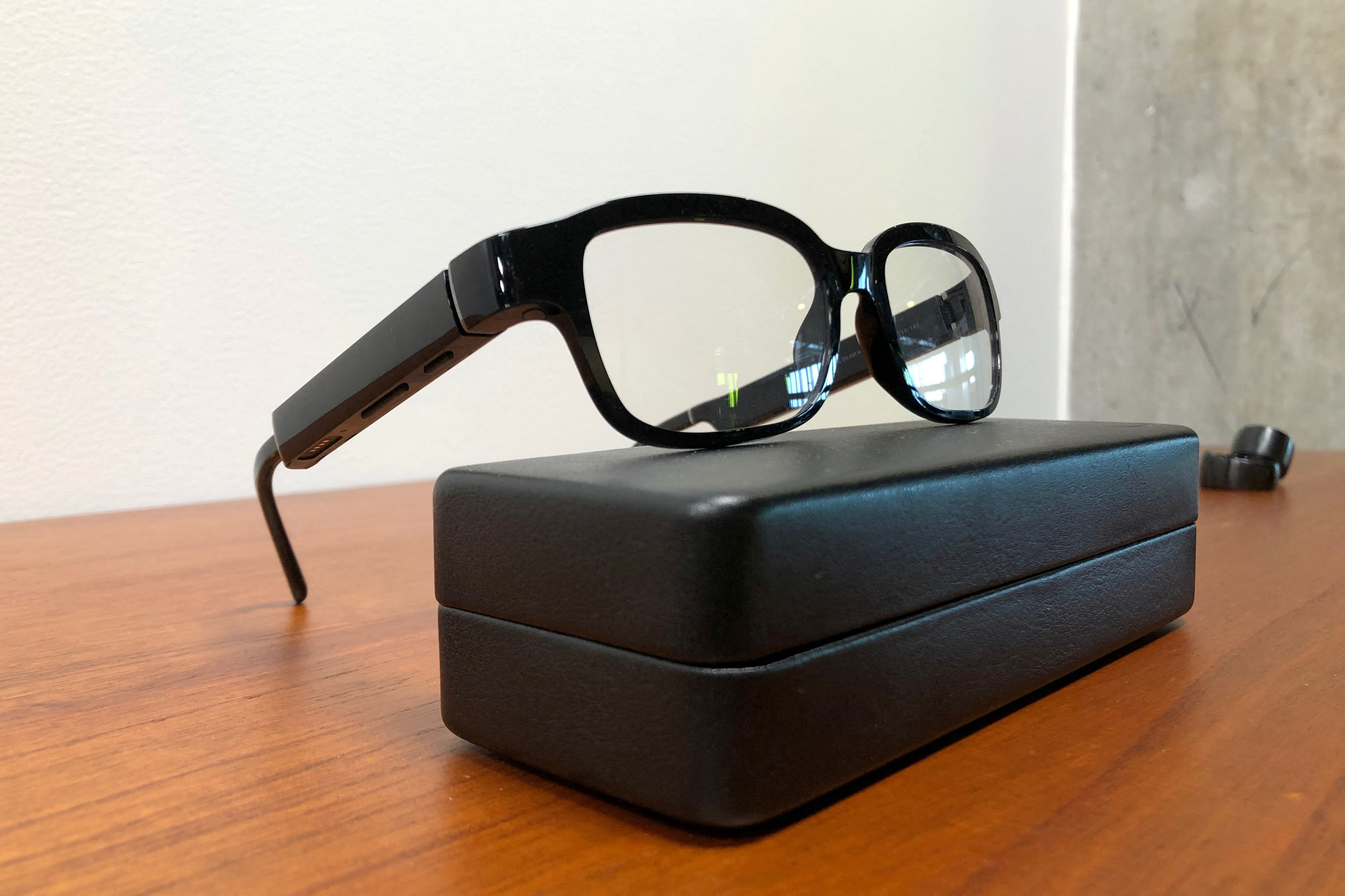 Amazon’s new eyeglasses that come with its virtual assistant Alexa, the Echo Frames, rest on a display in Seattle