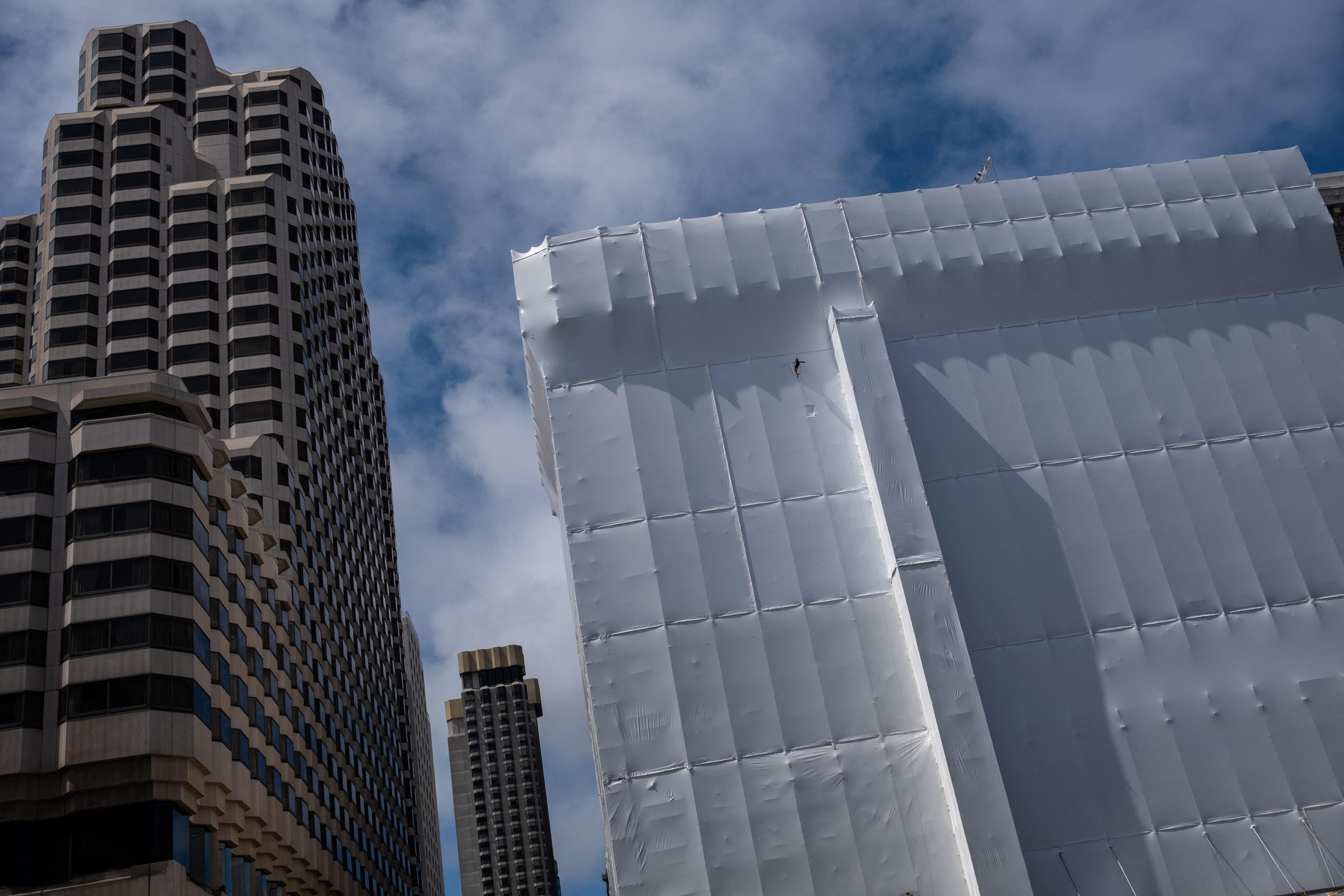 A building is seen covered with plastic at a residential area in downtown San Francisco, California