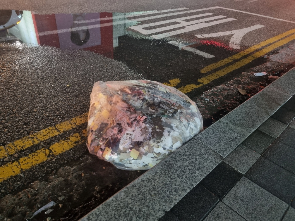 A plastic bag carrying various objects including what appeared to be trash that crossed inter-Korean border with a balloon believed to have been sent by North Korea, is pictured in Seoul