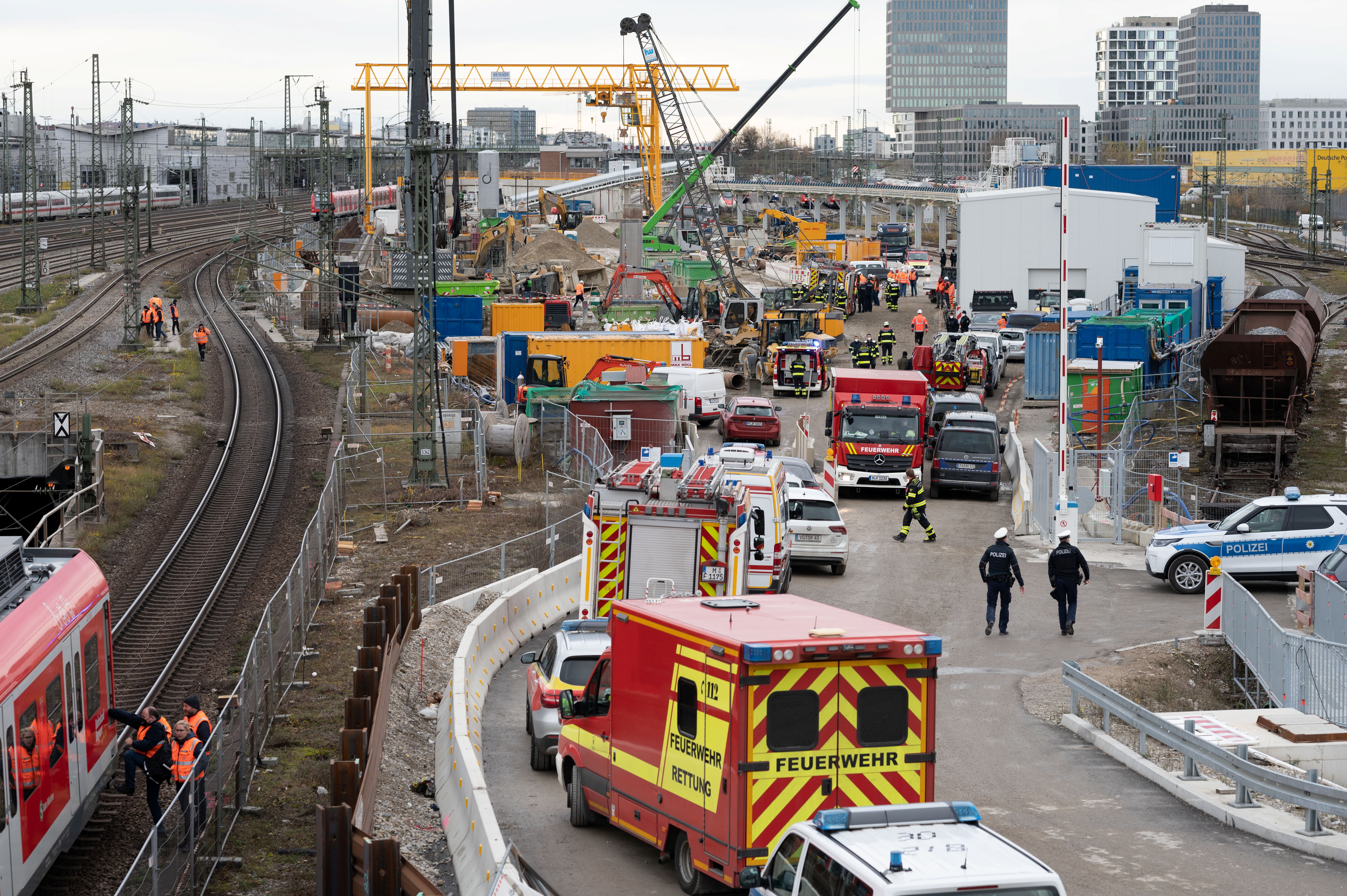 Police and firefighters secure the scene after an old aircraft bomb exploded during construction work at a bridge the busy main train station, injuring three people in Munich, Germany, December 1, 2021.     REUTERS/Andreas Gebert