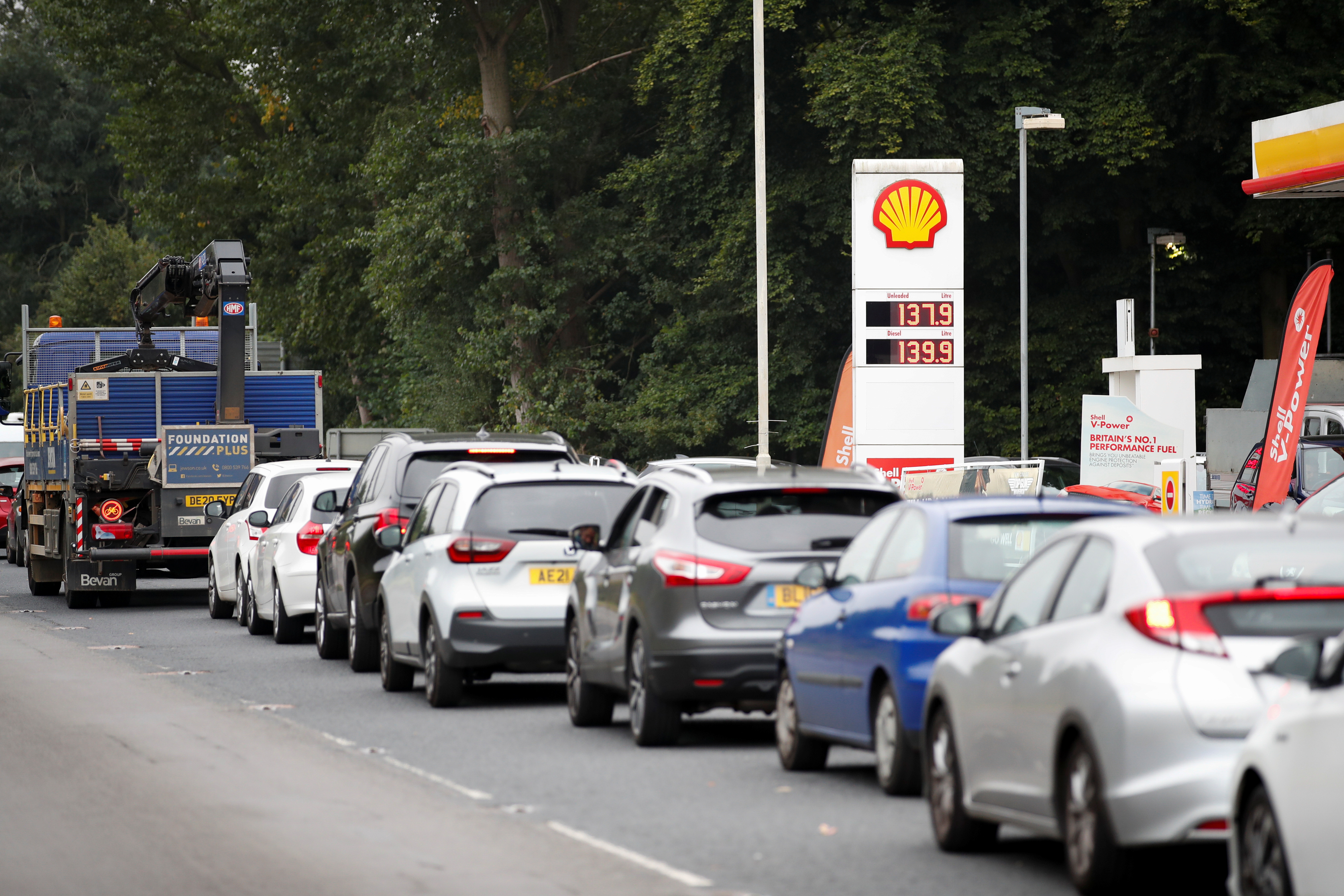 Vehicles queue to refill outside a Shell fuel station in Redbourn