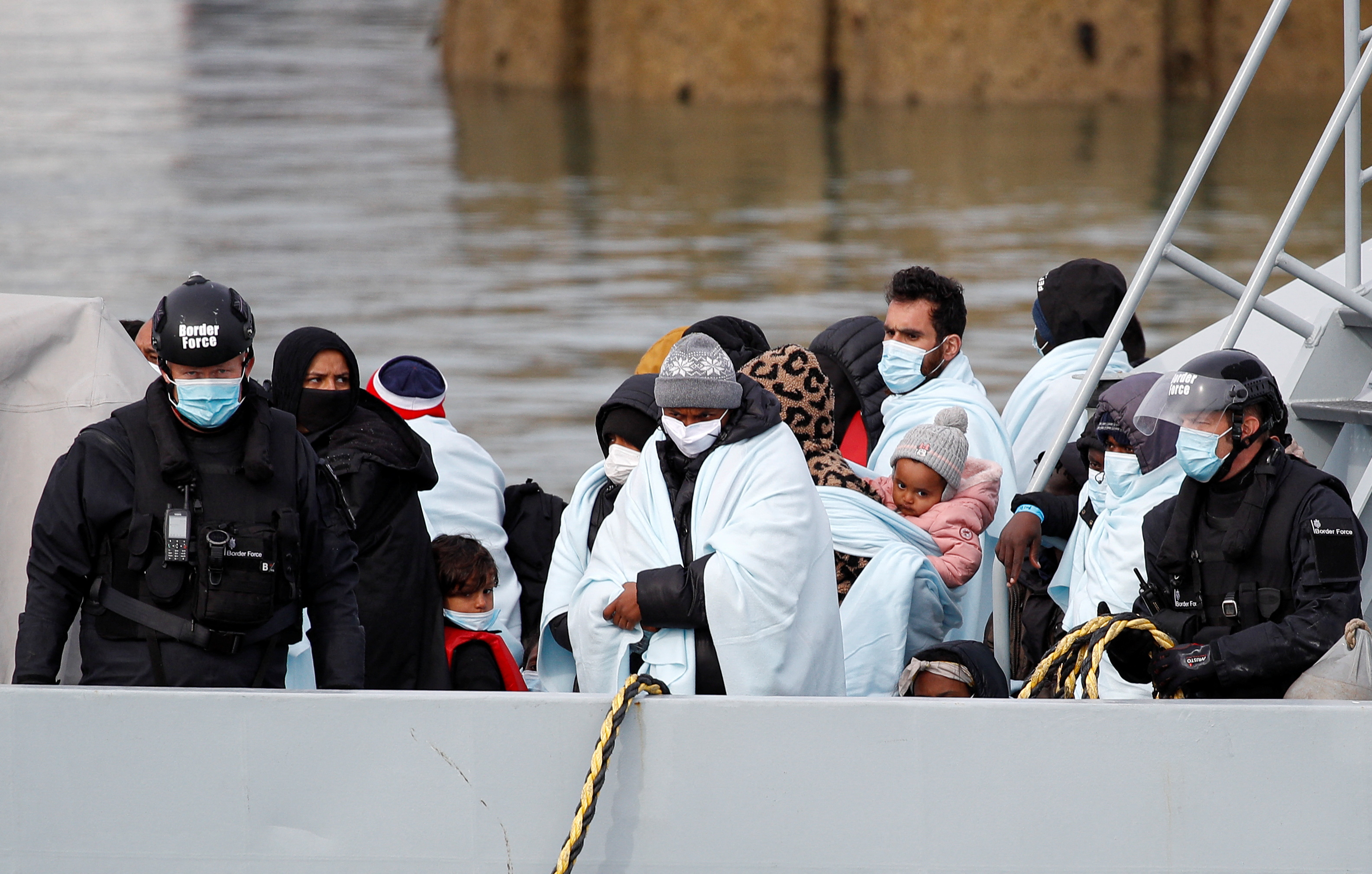 Migrants arrive in Dover after being rescued while crossing the English Channel
