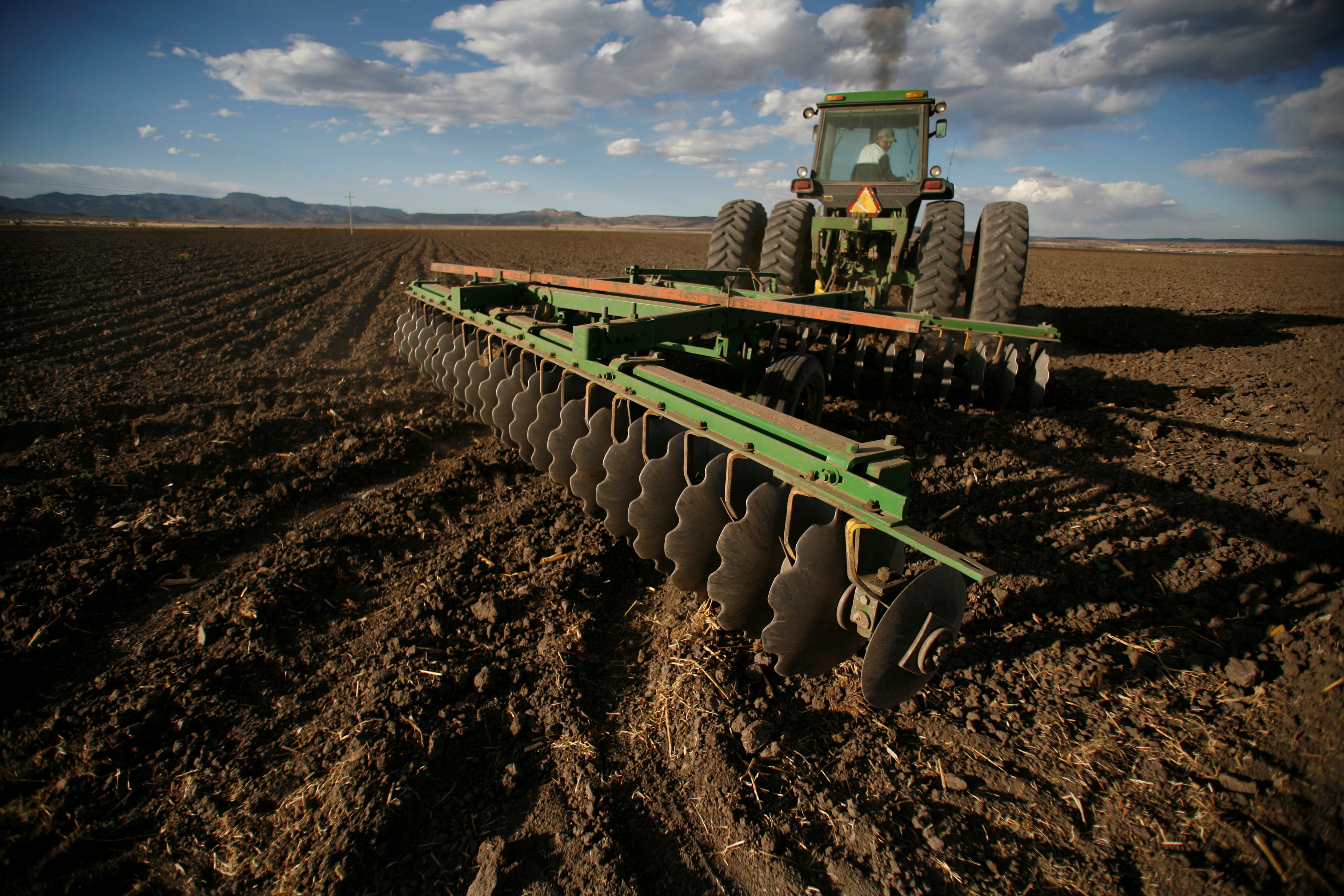 A tractor ploughs a hectare of land at Ejido Benito Juarez in the northern Mexican state of Chihuahua