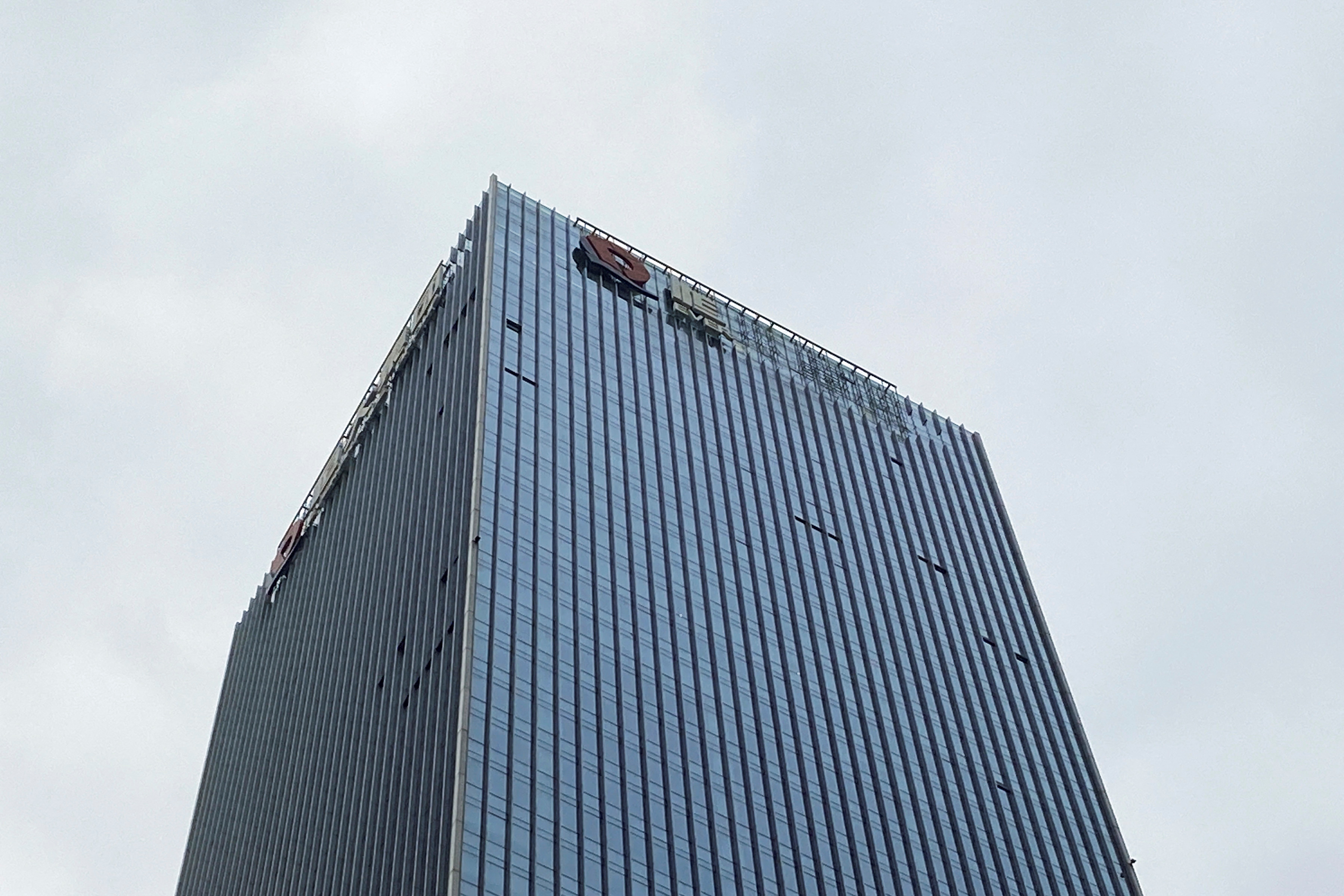 Partially removed company logo of China Evergrande Group in Shenzhen