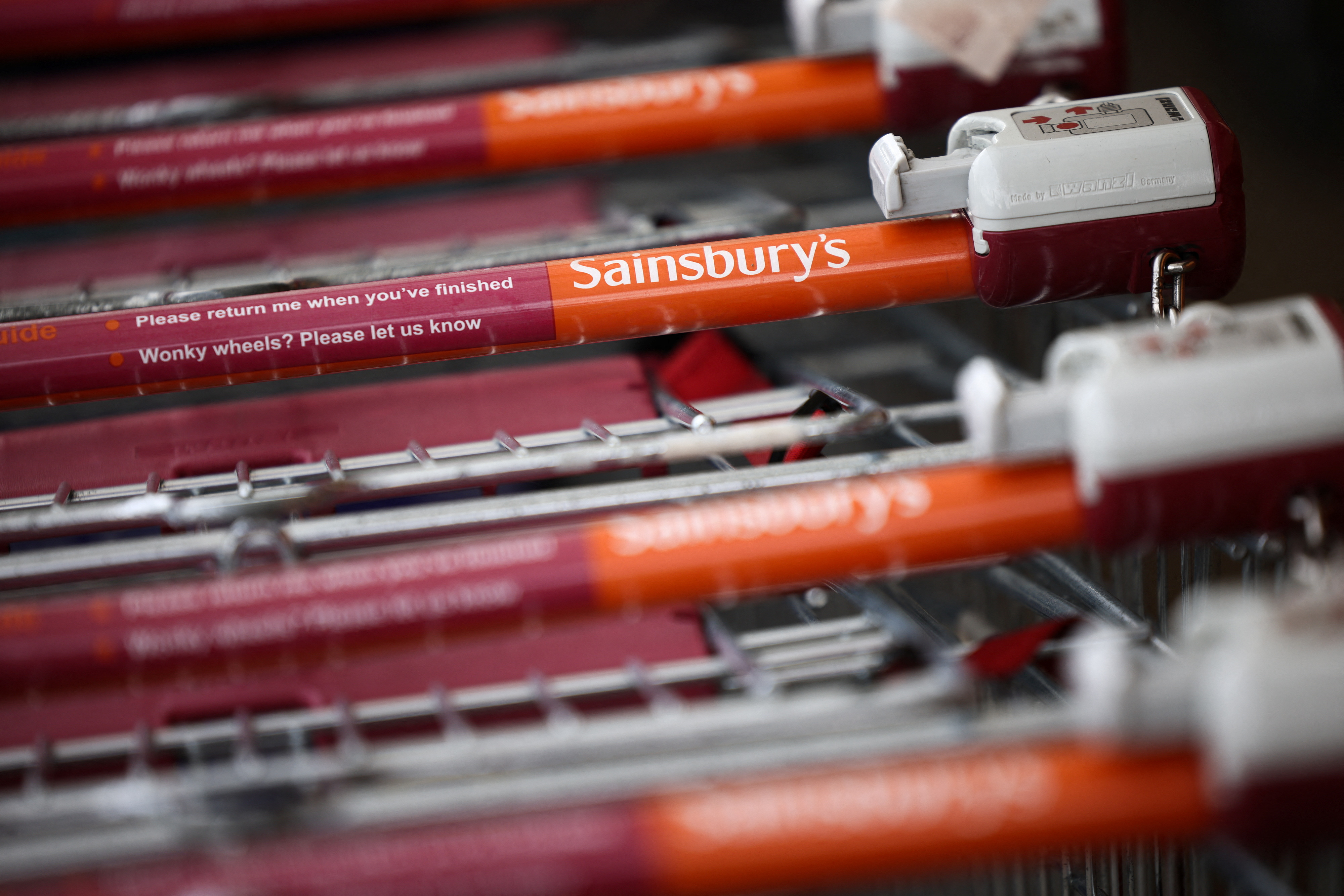 Trolleys stacked together inside a Sainsbury’s supermarket in Richmond, west London