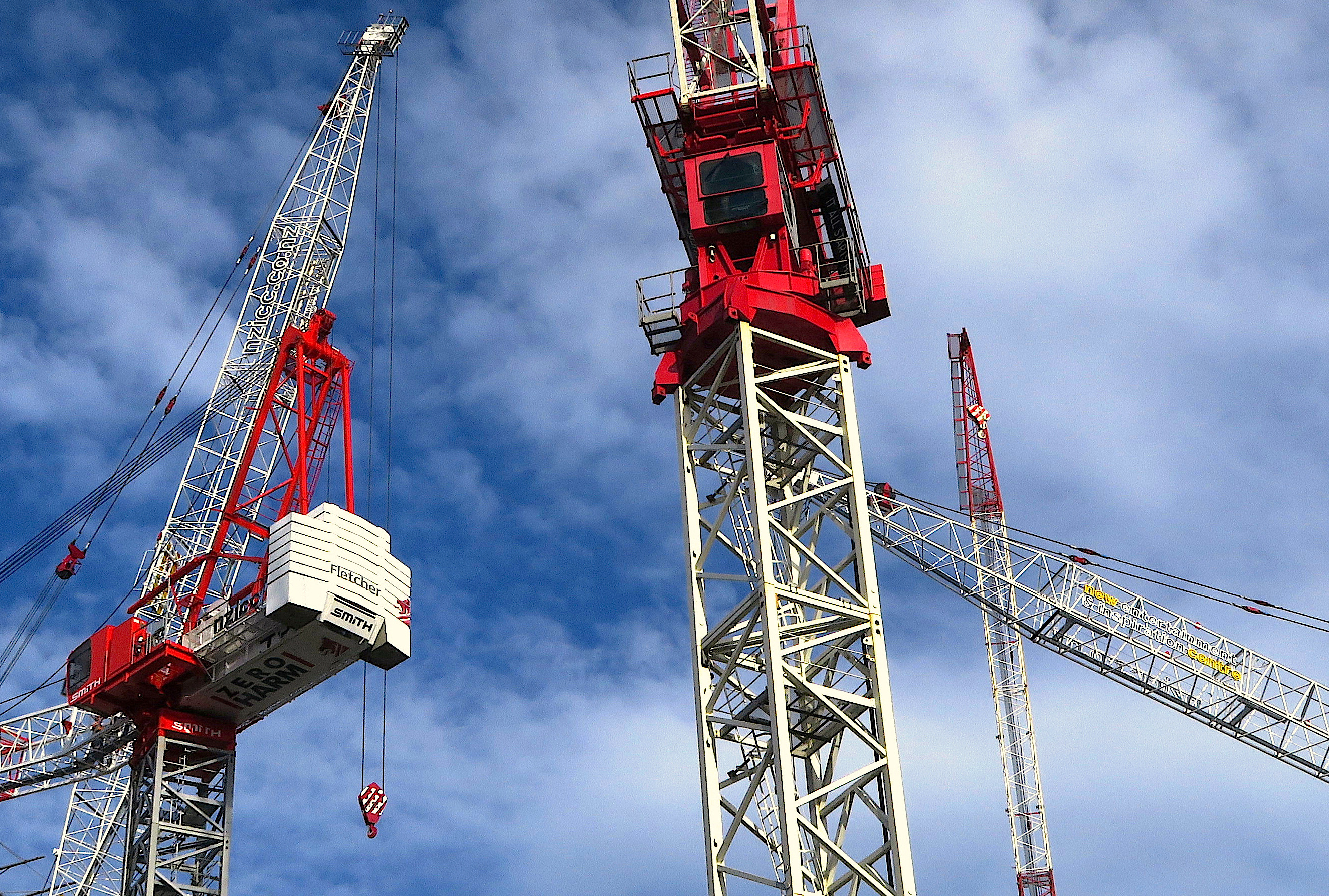 A sign for Fletcher Building Ltd, New Zealand's biggest builder, adorns a crane at a construction site in the New Zealand city of Auckland