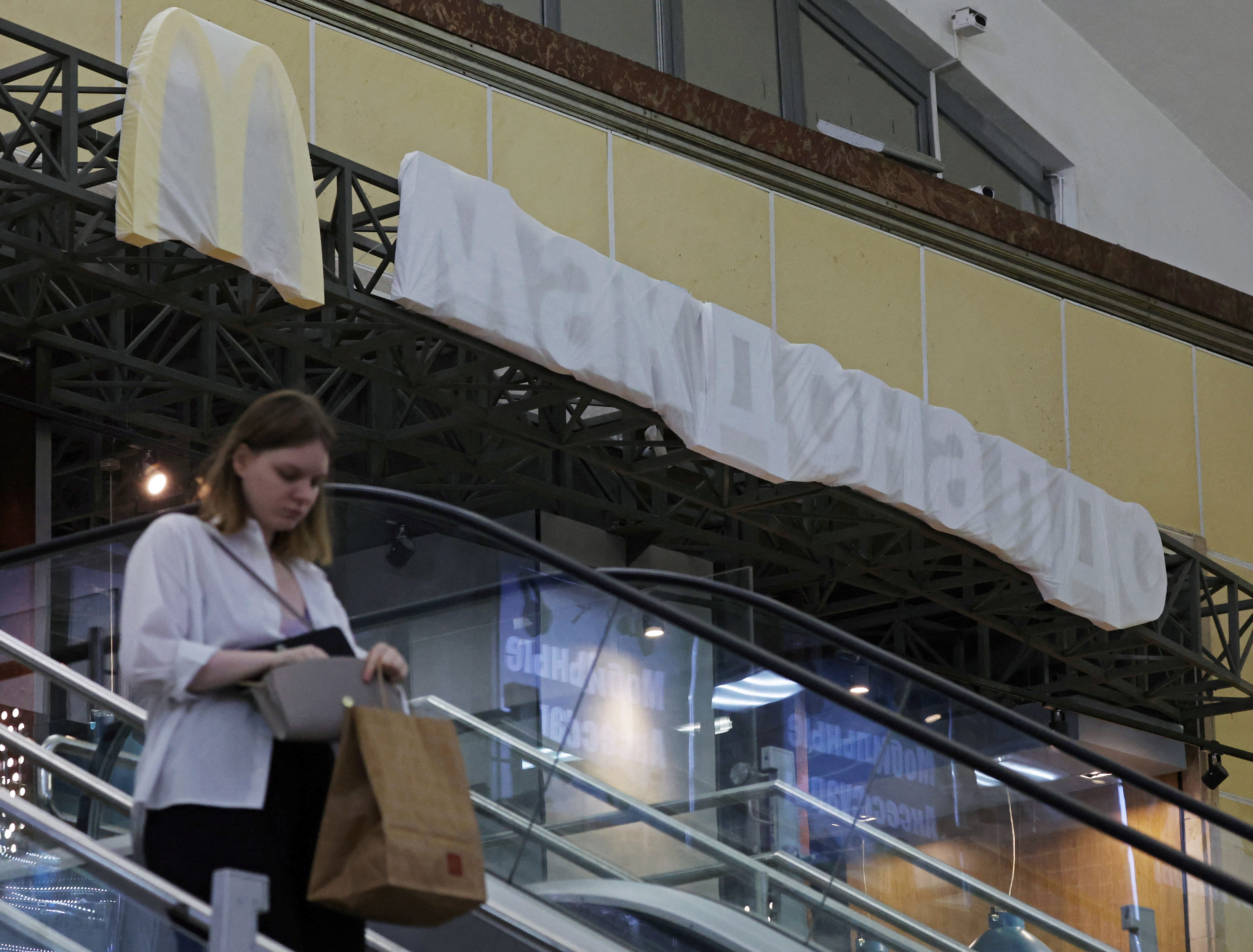 The McDonald’s logo is covered by fabric at a restaurant run by a franchisee at Finlandskiy railway station in Saint Petersburg