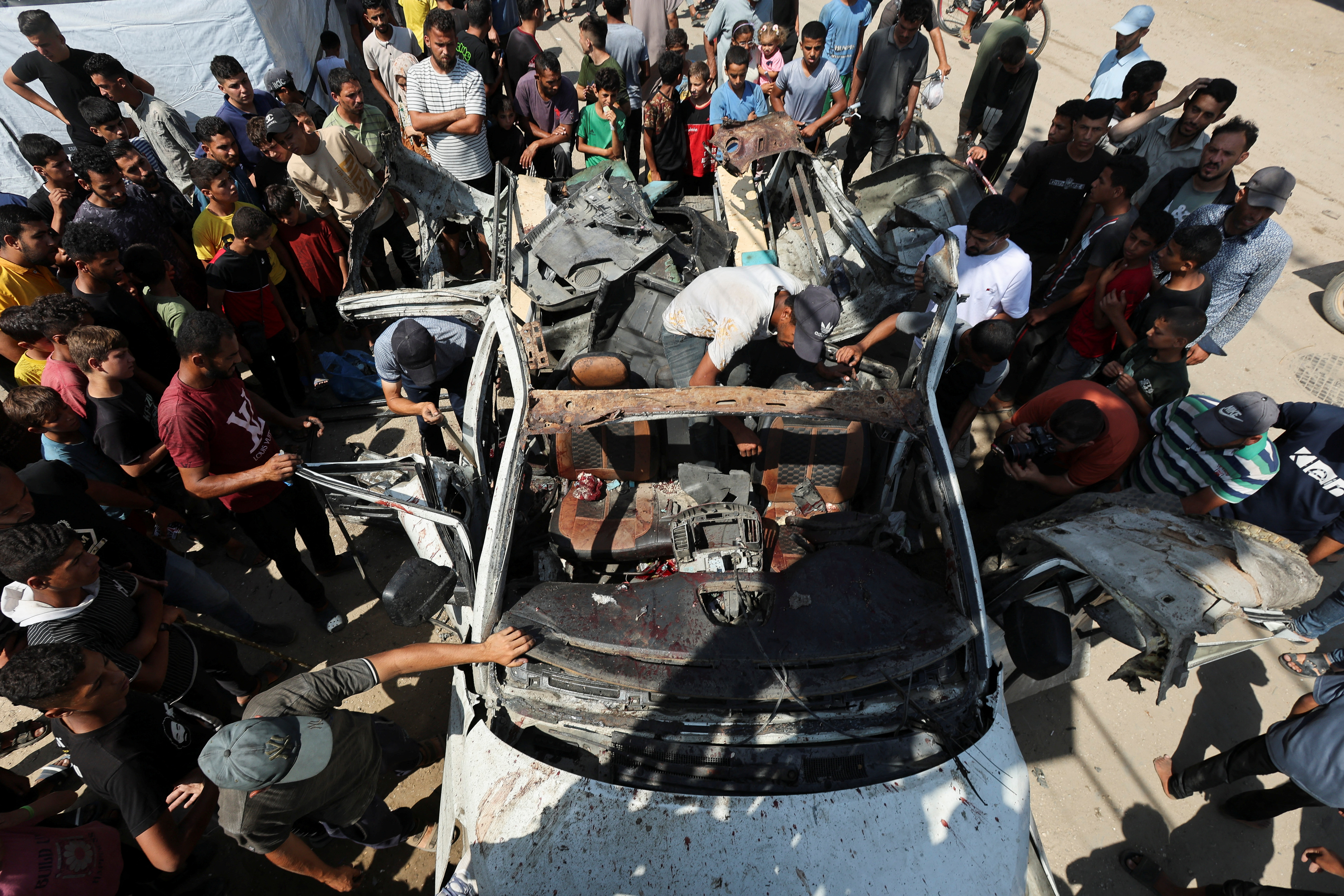 Aftermath of an Israeli strike on a vehicle in Deir Al-Balah in the central Gaza Strip