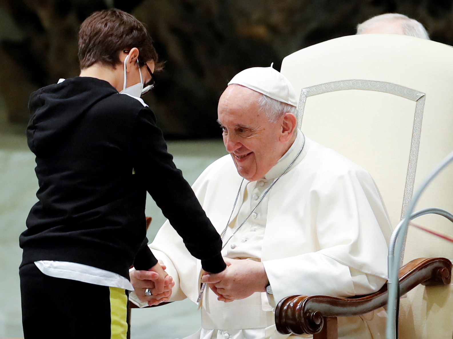 A boy greets Pope Francis during the weekly general audience at the Vatican, October 20, 2021. REUTERS/Remo Casilli