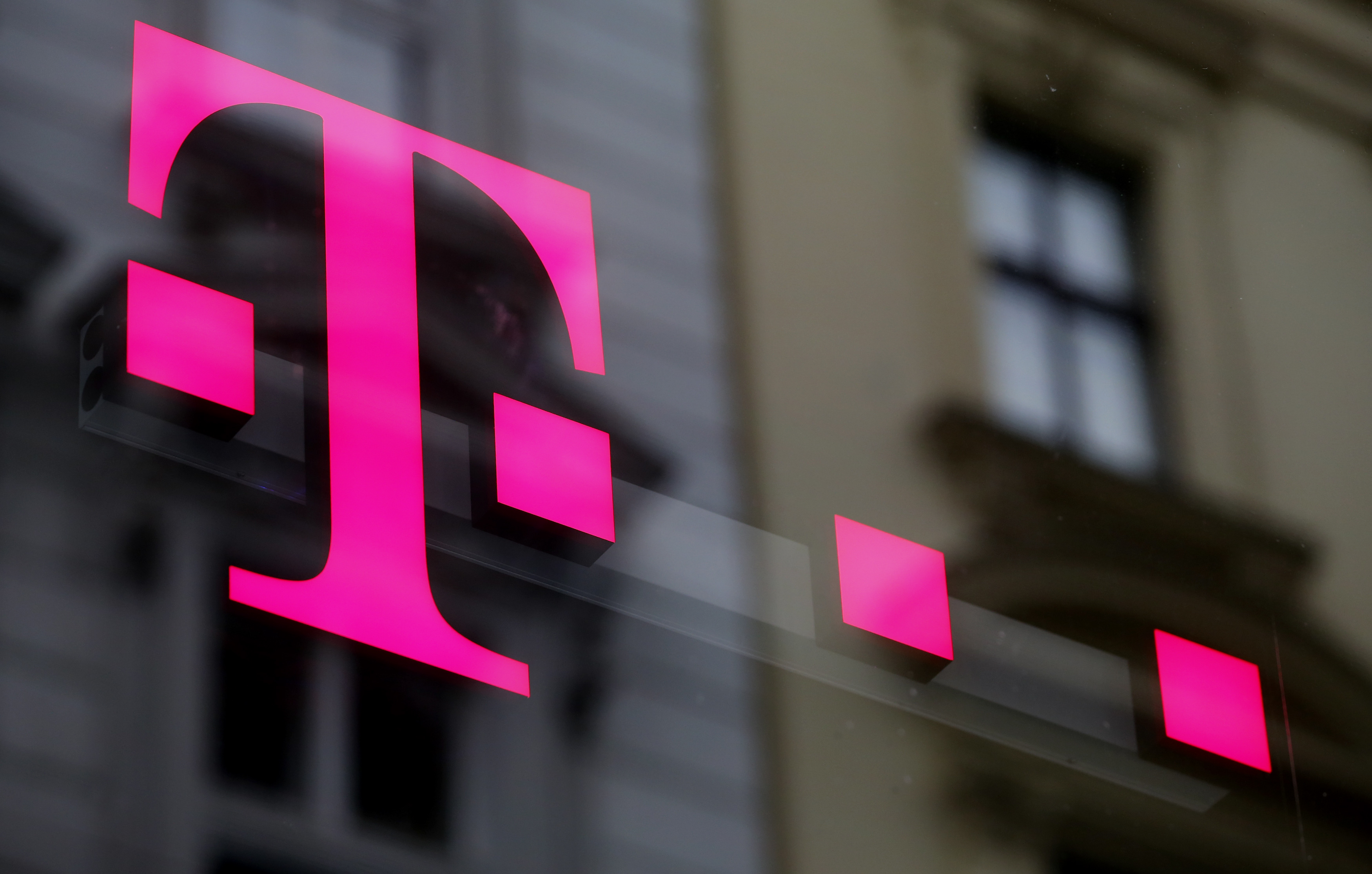 The logo of T-Mobile Austria is seen outside of one of its shops in Viennaa, Austria, February 25, 2016.   REUTERS/Leonhard Foeger/Files
