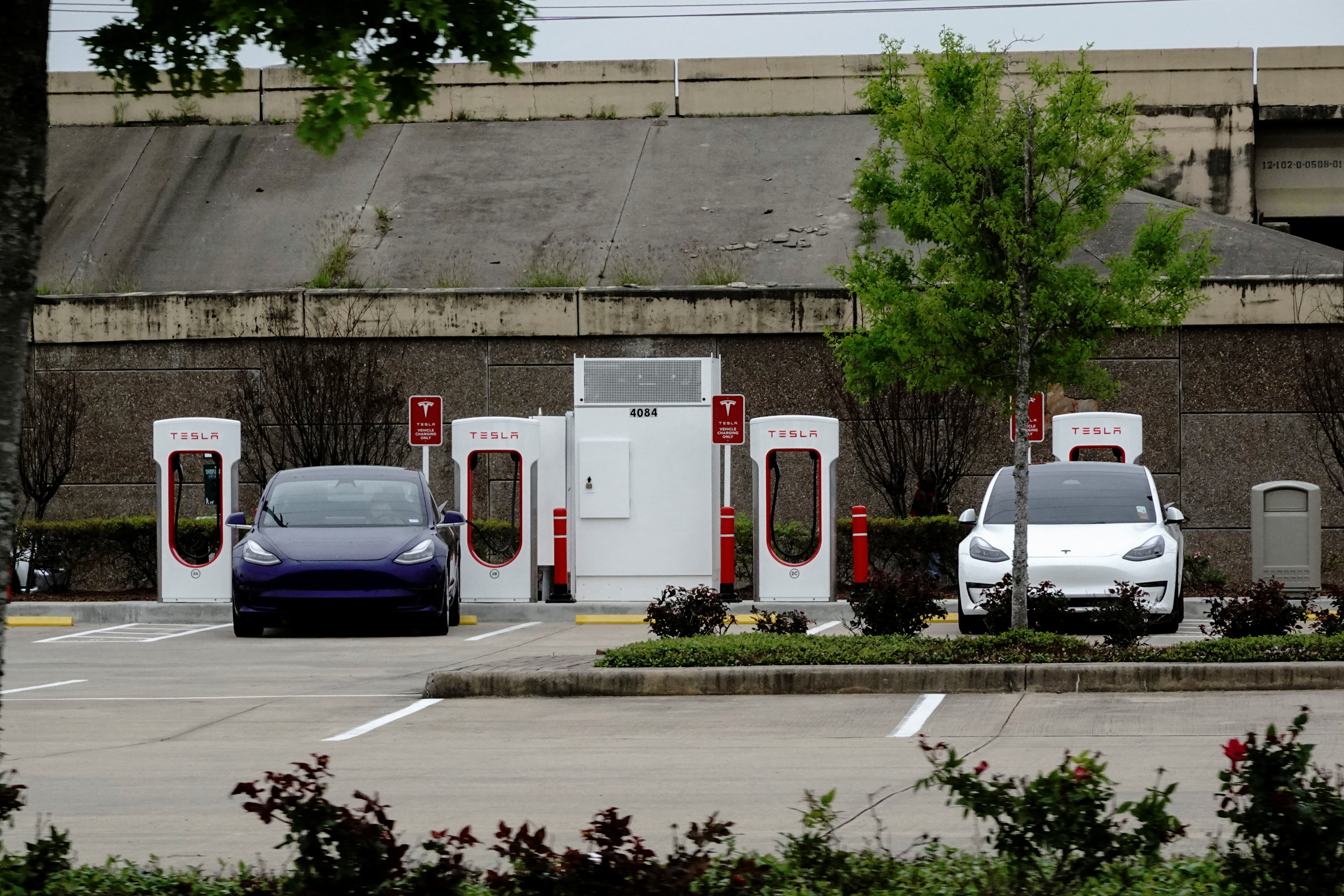 Tesla electric vehicles (EVs) fast-charge using Tesla Superchargers at a Buc-ee’s travel center and gas station in Baytown, Texas