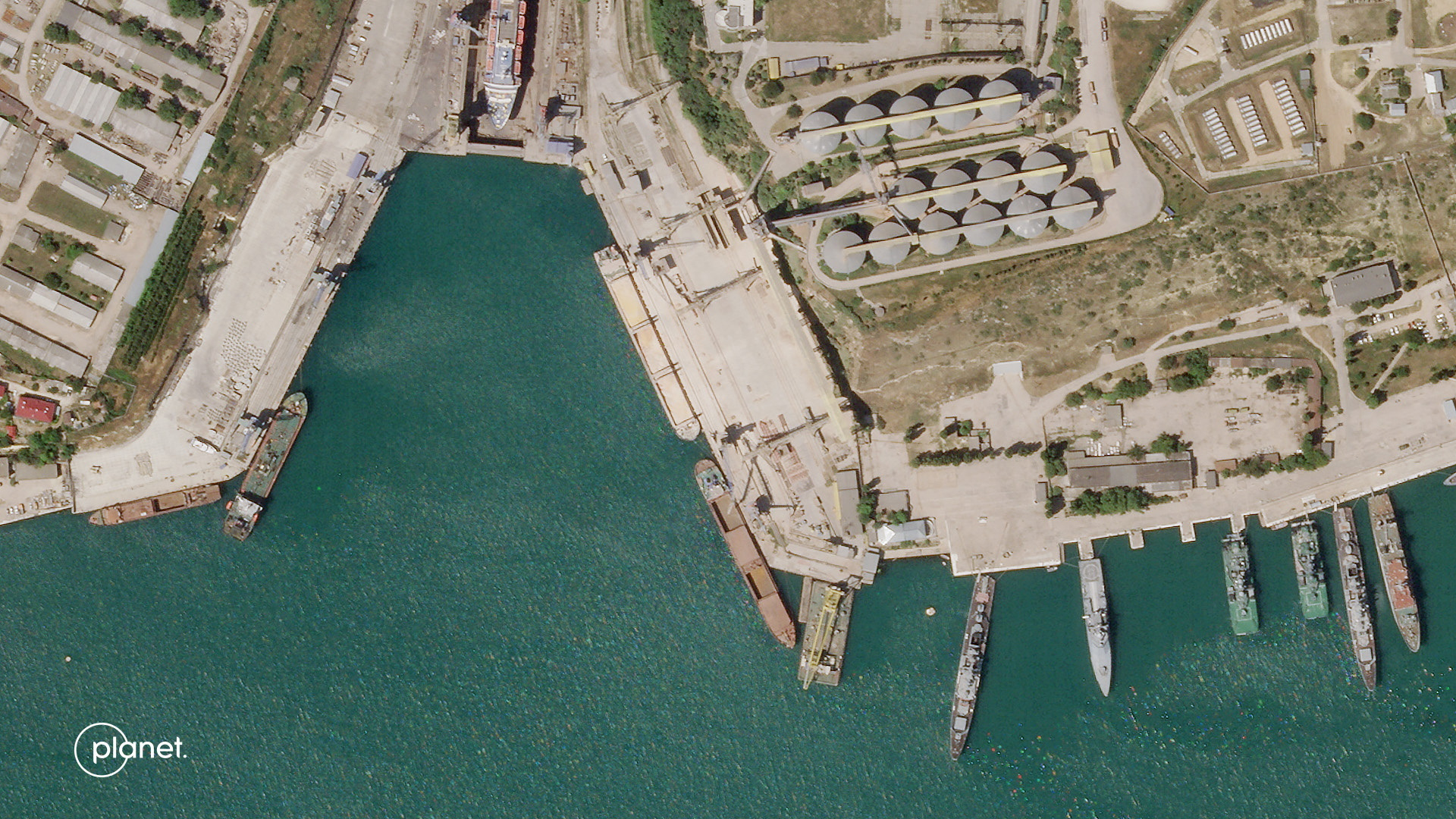 A satellite image from Planet Labs PBC shows the Russian-flagged SV Nikolay at the Aval grain terminal in Sevastopol