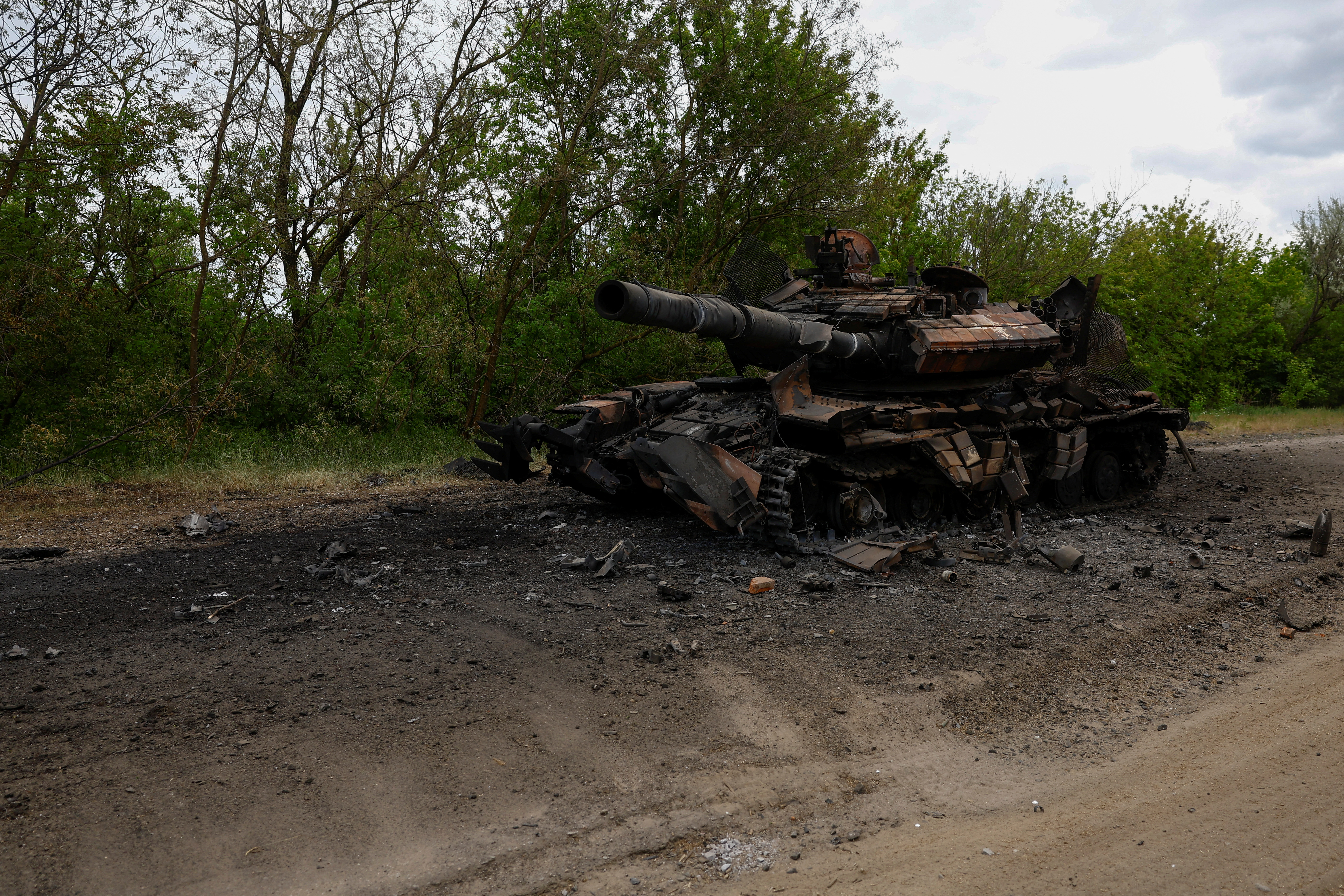 Destroyed tank is seen on a road in Kharkiv region