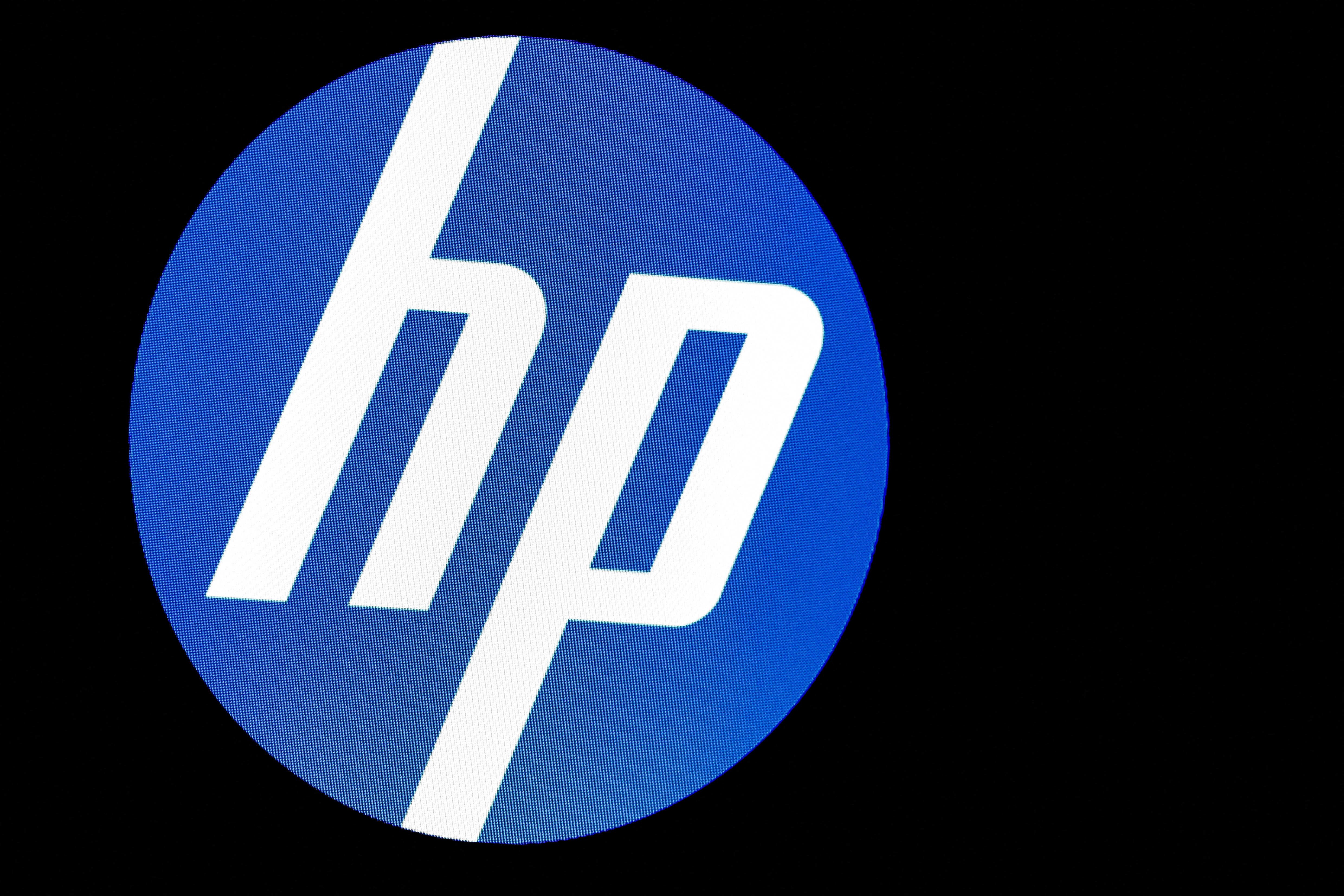 A screen displays the logo for HP Inc. at the NYSE in New York